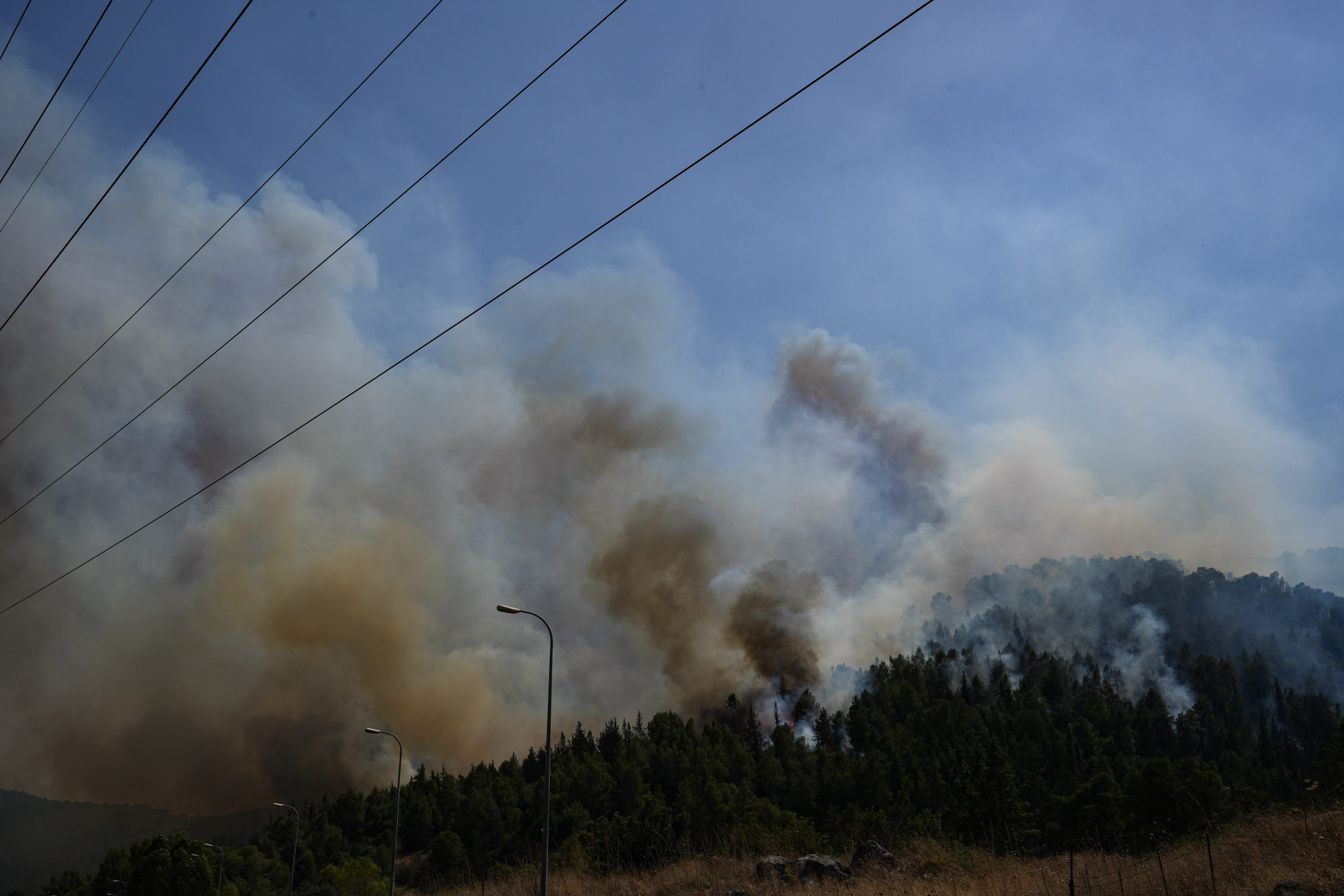 Smoke billows from an area hit by rockets launched from southern Lebanon, in the northern Israeli border with Lebanon, on Thursday. Photo: JINI via Xinhua