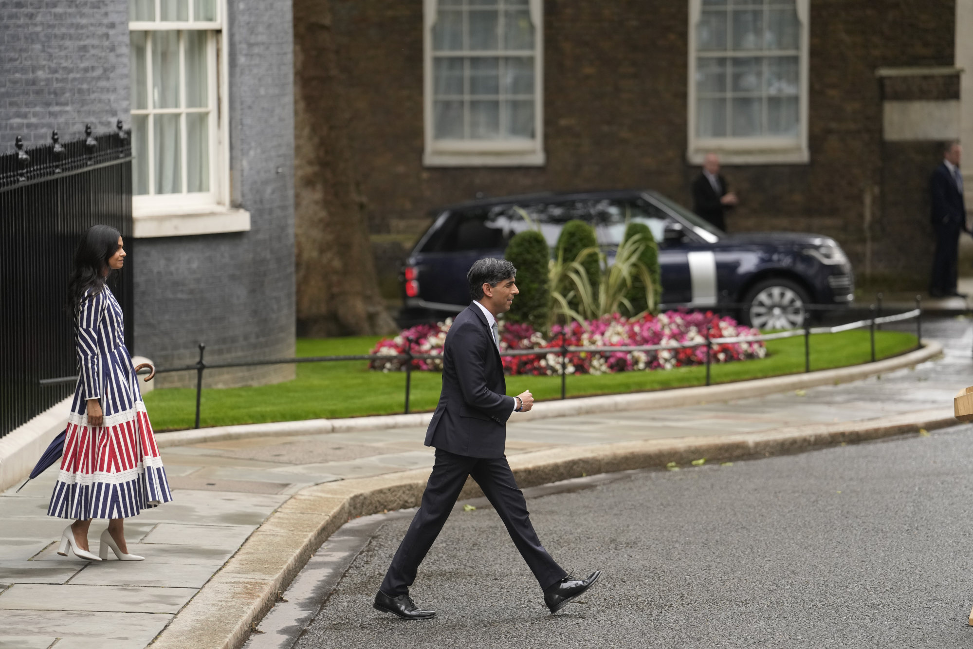 Britain’s outgoing Conservative Party prime minister Rishi Sunak with his wife Akshata Murty walk out of 10 Downing Street to a podium where Sunak made a short speech before going to see King Charles III to tender his resignation in London, on July 5. Photo: AP