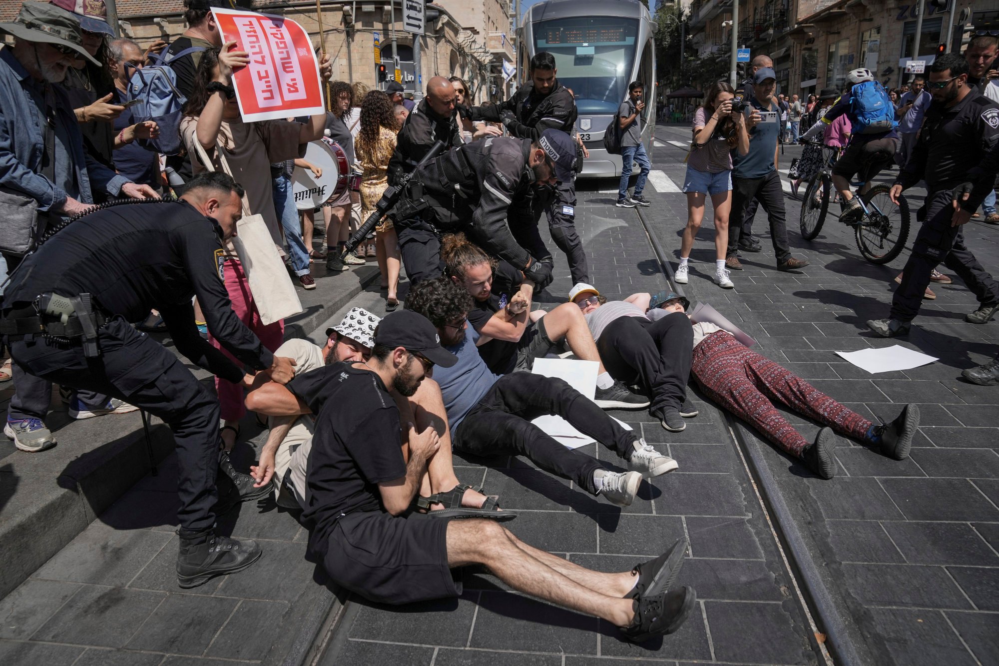 Police disperse demonstrators blocking a road during a protest marking nine months since the start of the war and calling for the release of hostages held in the Gaza Strip, in Jerusalem, on Sunday. Photo: AP
