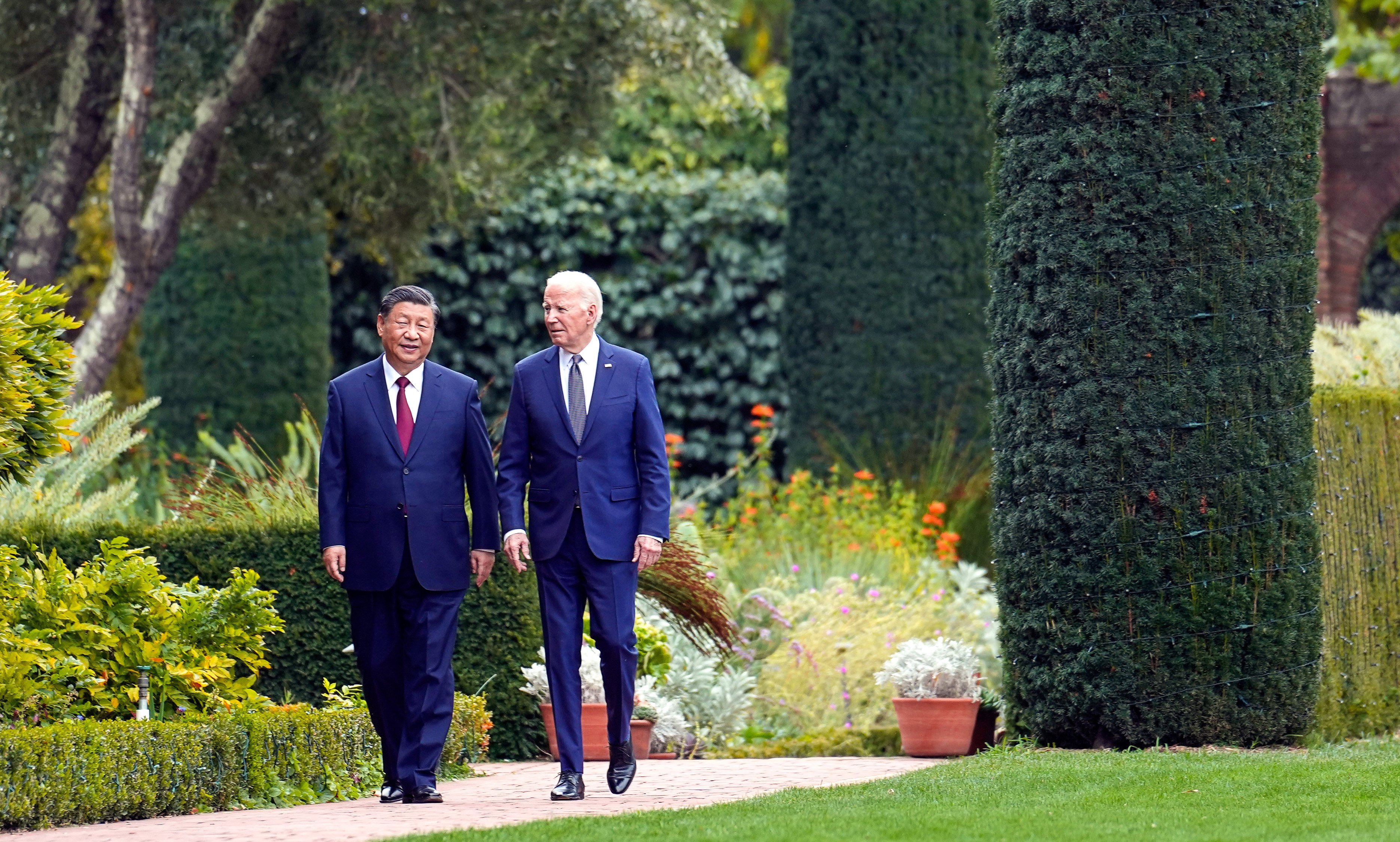 Presidents Xi Jinping and Joe Biden walk in the gardens at the Filoli Estate in Woodside, California, during their summit in November 2023. Photo: AP