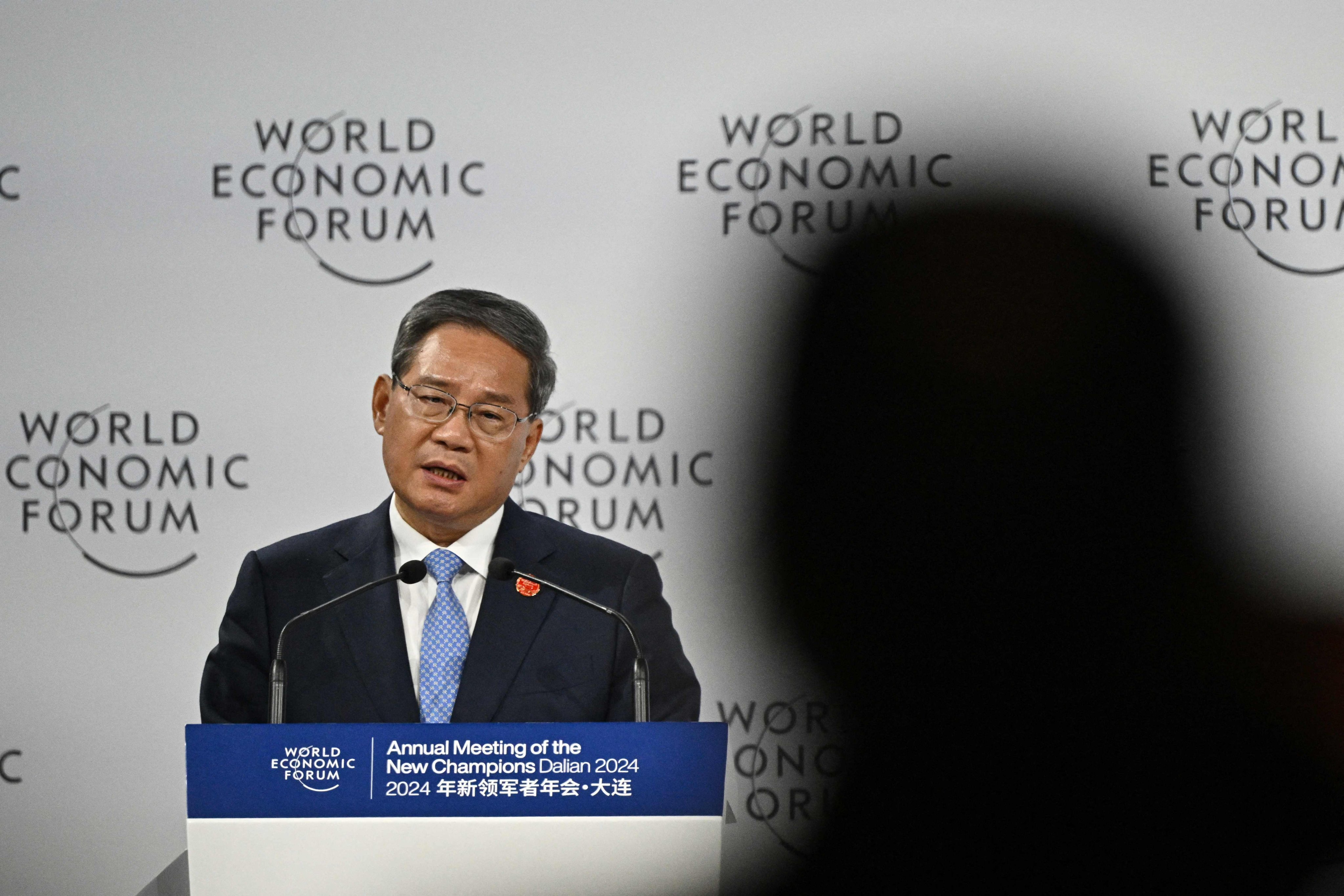 Chinese Premier Li Qiang delivers his speech during the opening ceremony of the World Economic Forum Annual Meeting of the New Champions in Dalian. Photo: AFP