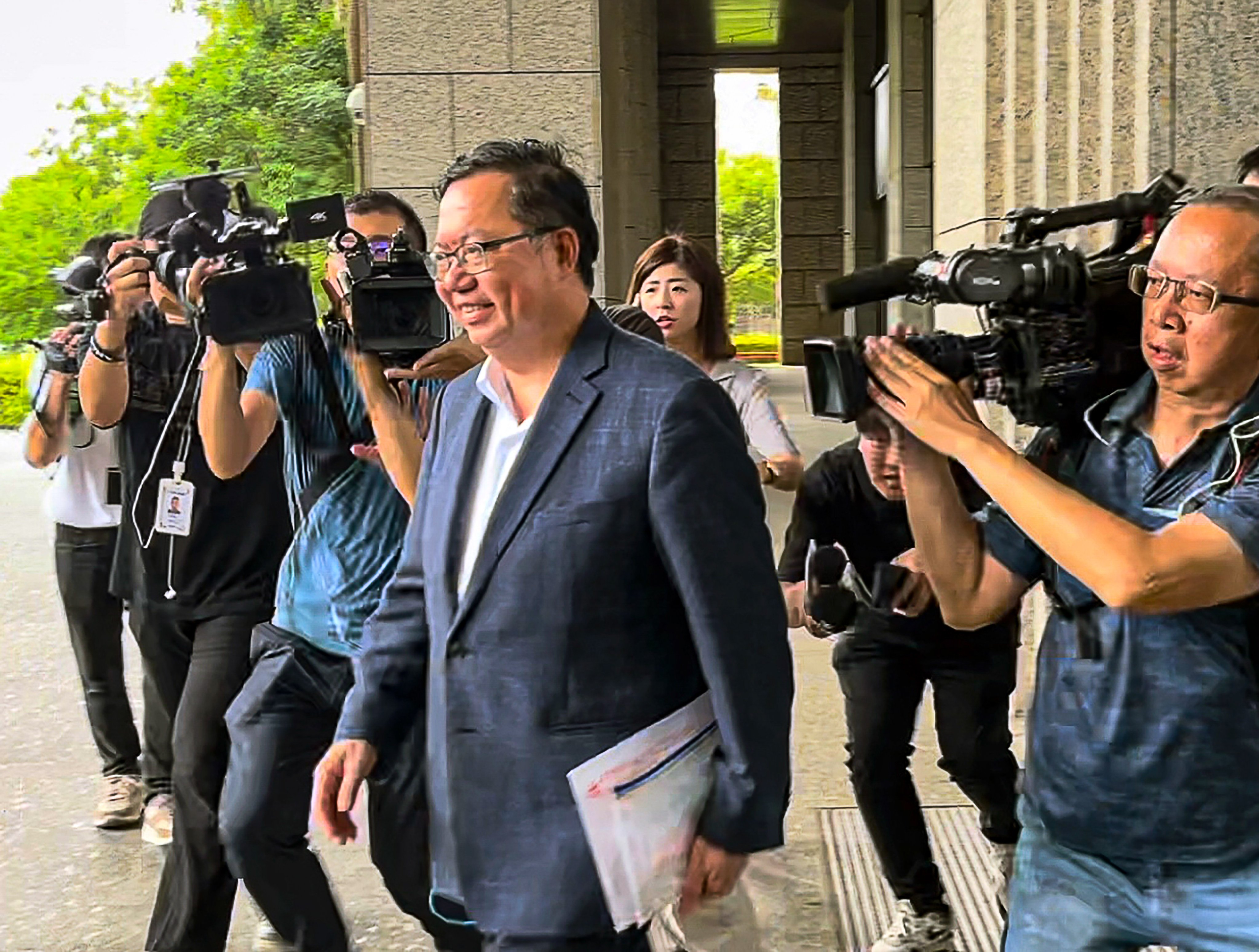 Cheng Wen-tsan, who has been charged with corruption,  leaves court in Taipei on July 6. On Monday, Taiwan’s High Court overruled a bail decision and asked for a review of the detention case. Photo: CNA