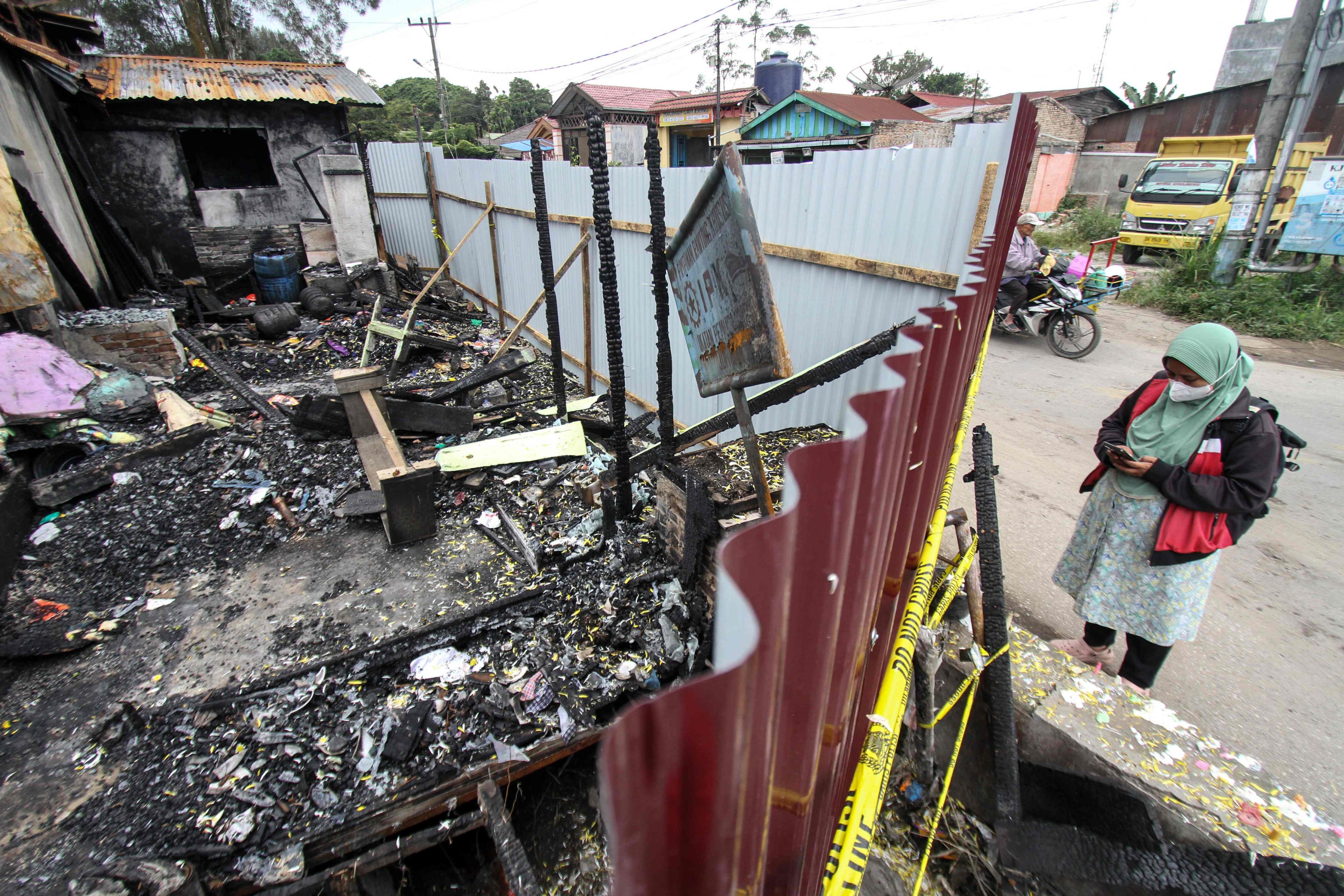 The burnt house of 40-year-old journalist Rico Sempurna Pasaribu, who died in a fire with his wife, child and grandchild, in Kabanjahe, North Sumatra. Photo: AFP