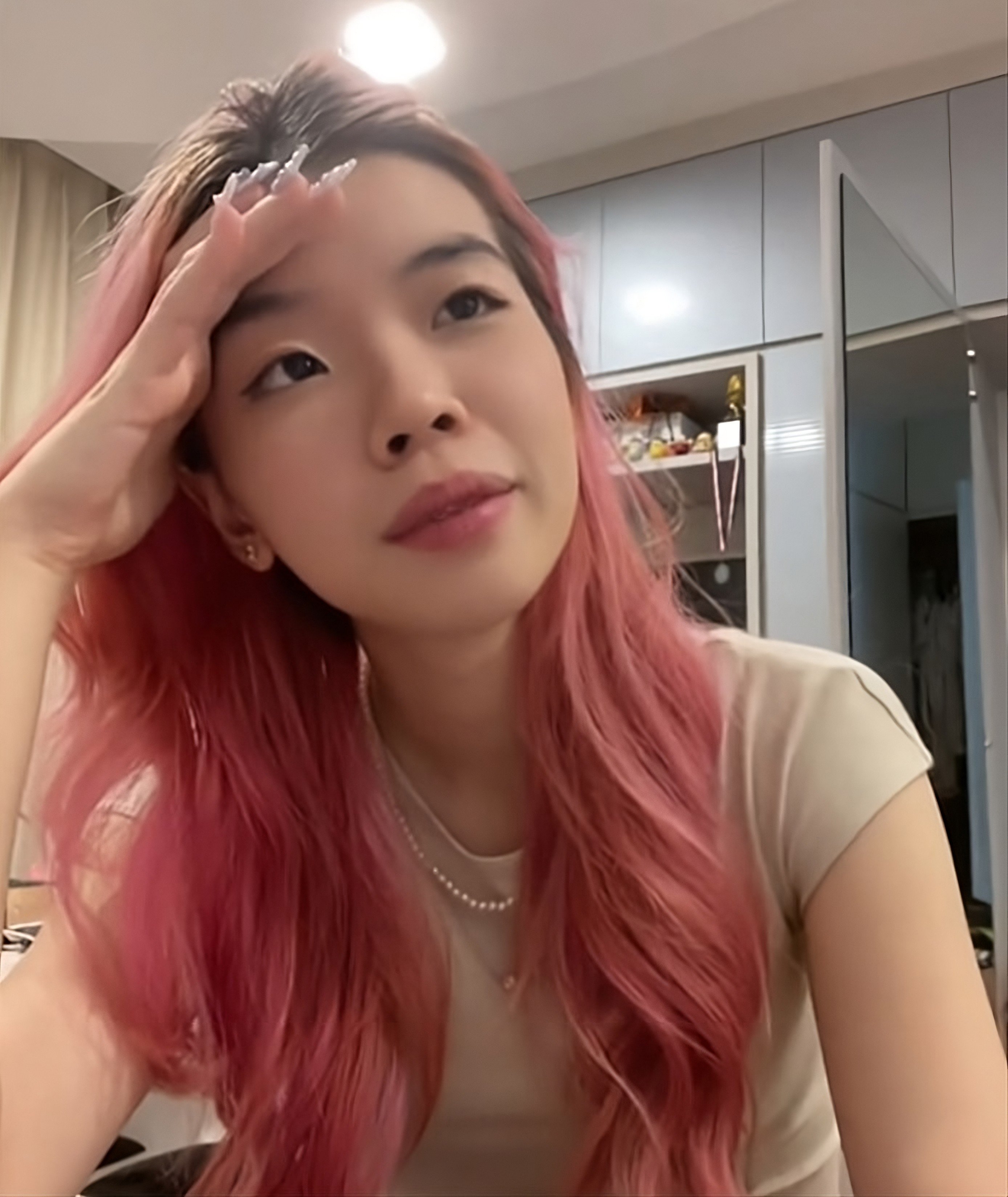 “I would do anything for money, just not this.” Lai Yi Jing made a TikTok video to raise awareness of the sexually suggestive scheme. Photo: TikTok/y1jingg