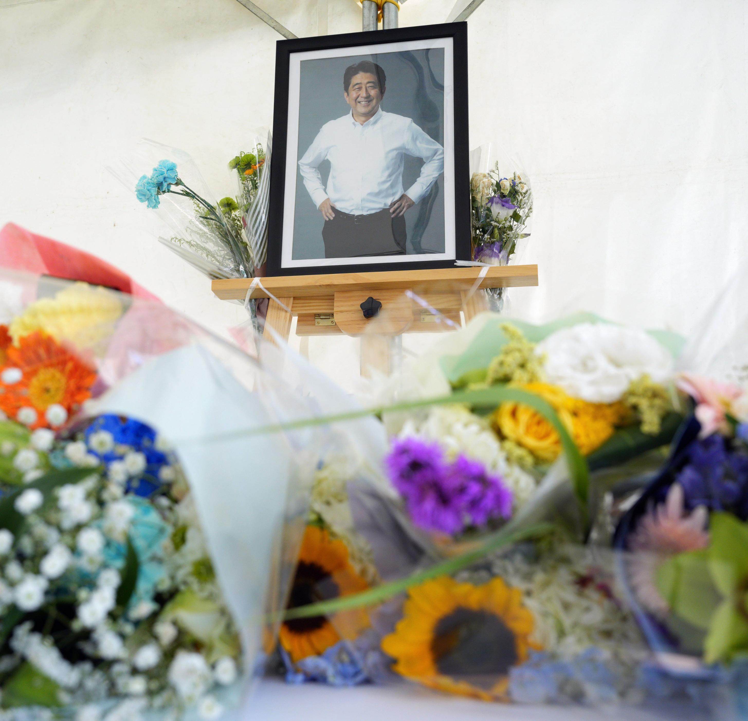 Photo of former Japanese Prime  Minister Shinzo Abe is seen placed on a podium on the second anniversary of his assassination in the western Japan city of Nara. Photo: Kyodo