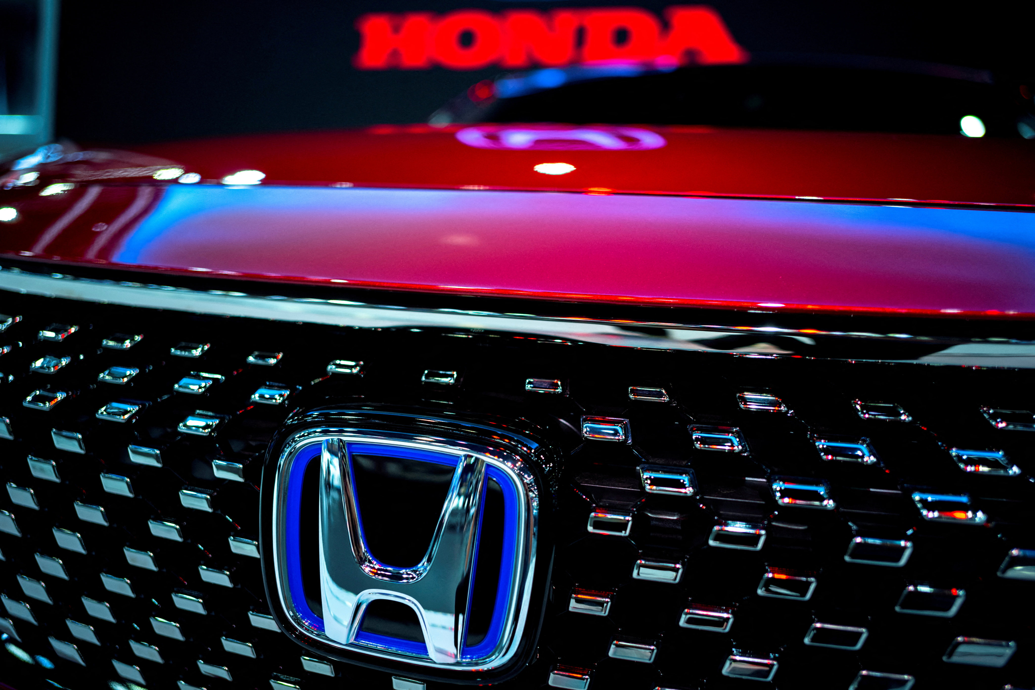 The Honda logo is seen on a vehicle at the 43rd Bangkok International Motor Show in Bangkok on March 22, 2022. Photo: Reuters