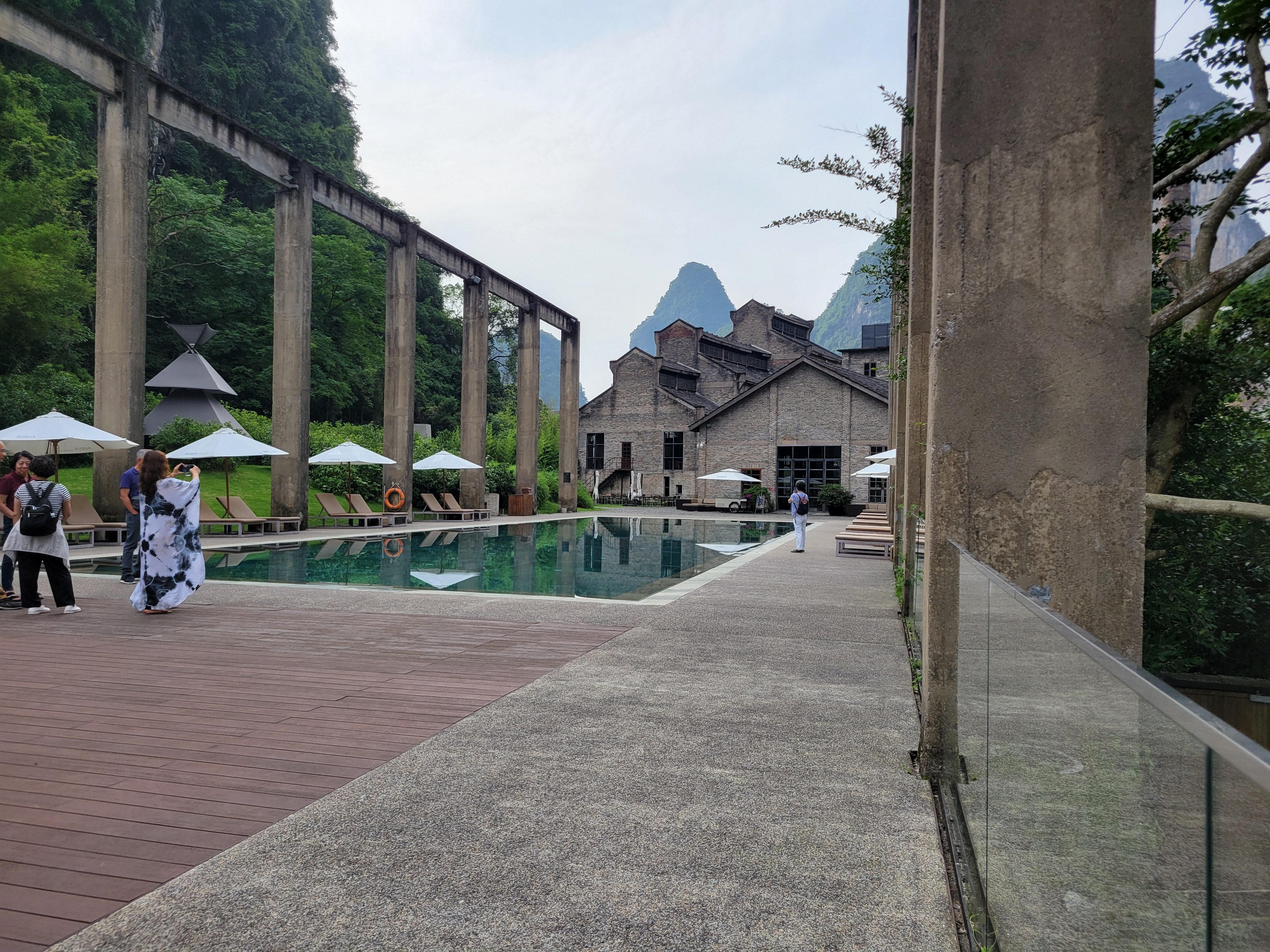 The Yangshuo Sugar House pool is surrounded by concrete pillars left behind from the site’s factory days. Photo: Kristian Odebjer