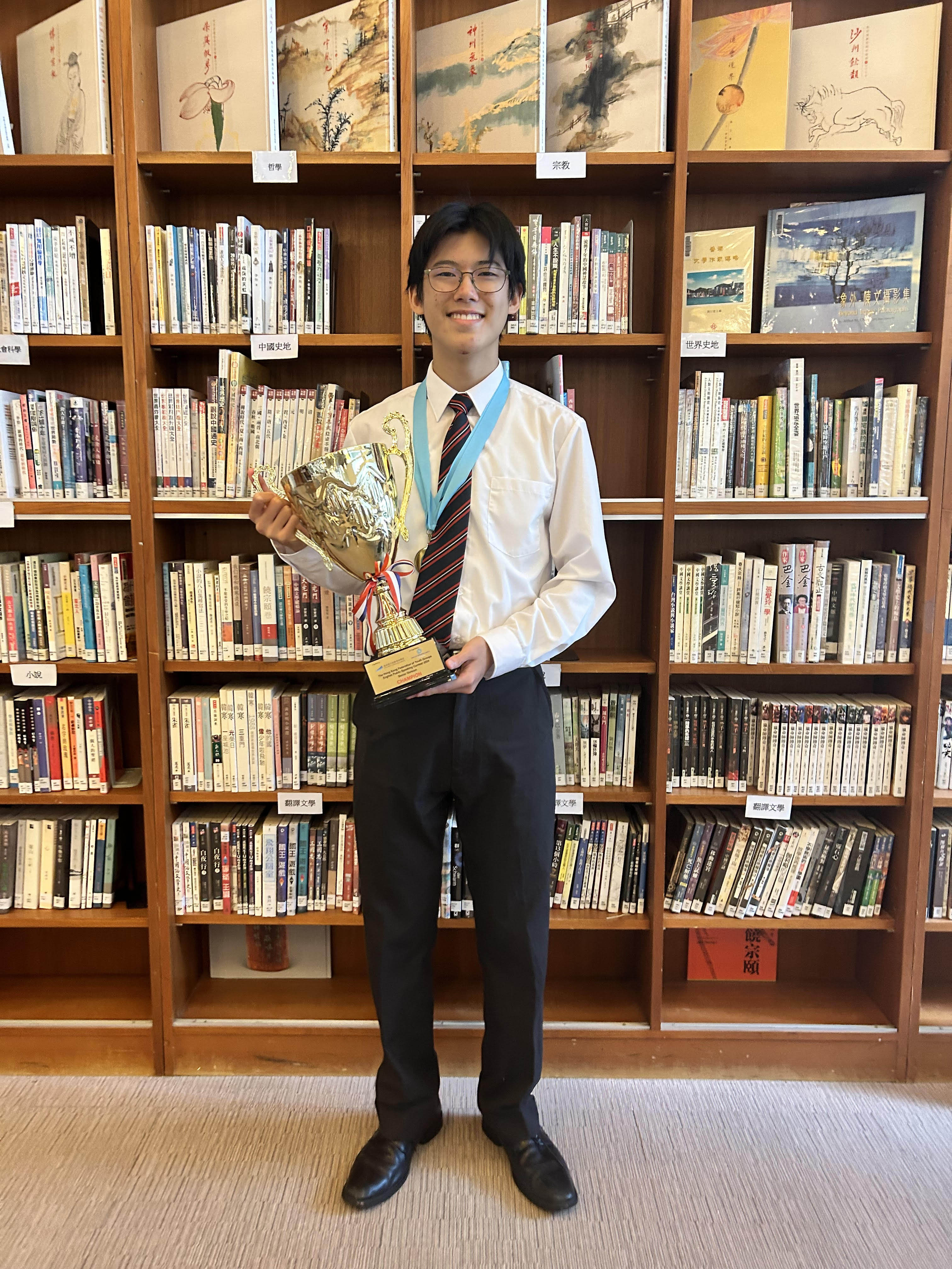 Benjamin Wu poses with his trophy at Diocesan Boys’ School. Photo: Kathryn Giordano