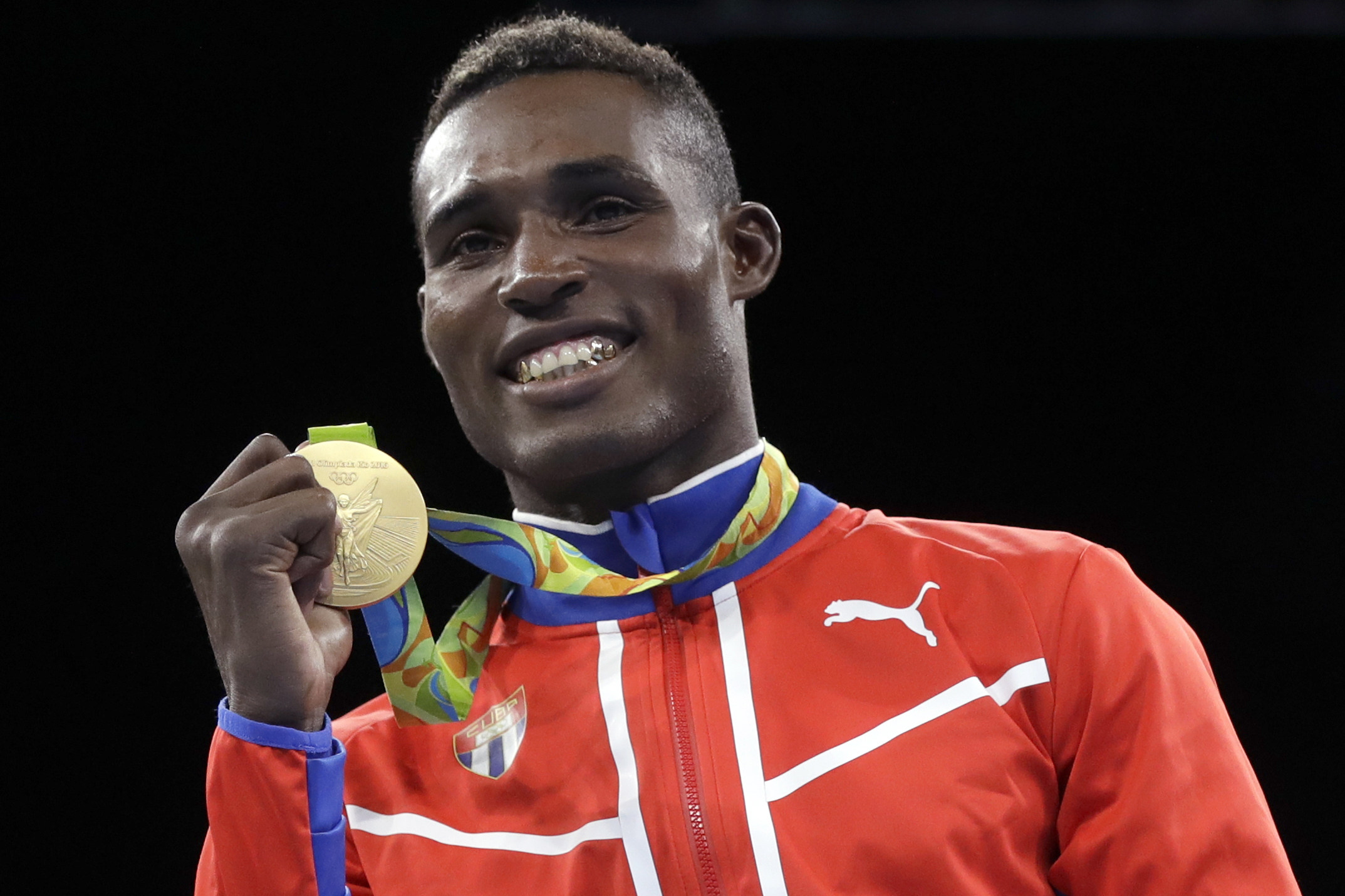 Cuba’s Julio Cesar La Cruz is taking a shot at joining the exclusive club of three-time gold medalists in boxing. Photo: AP