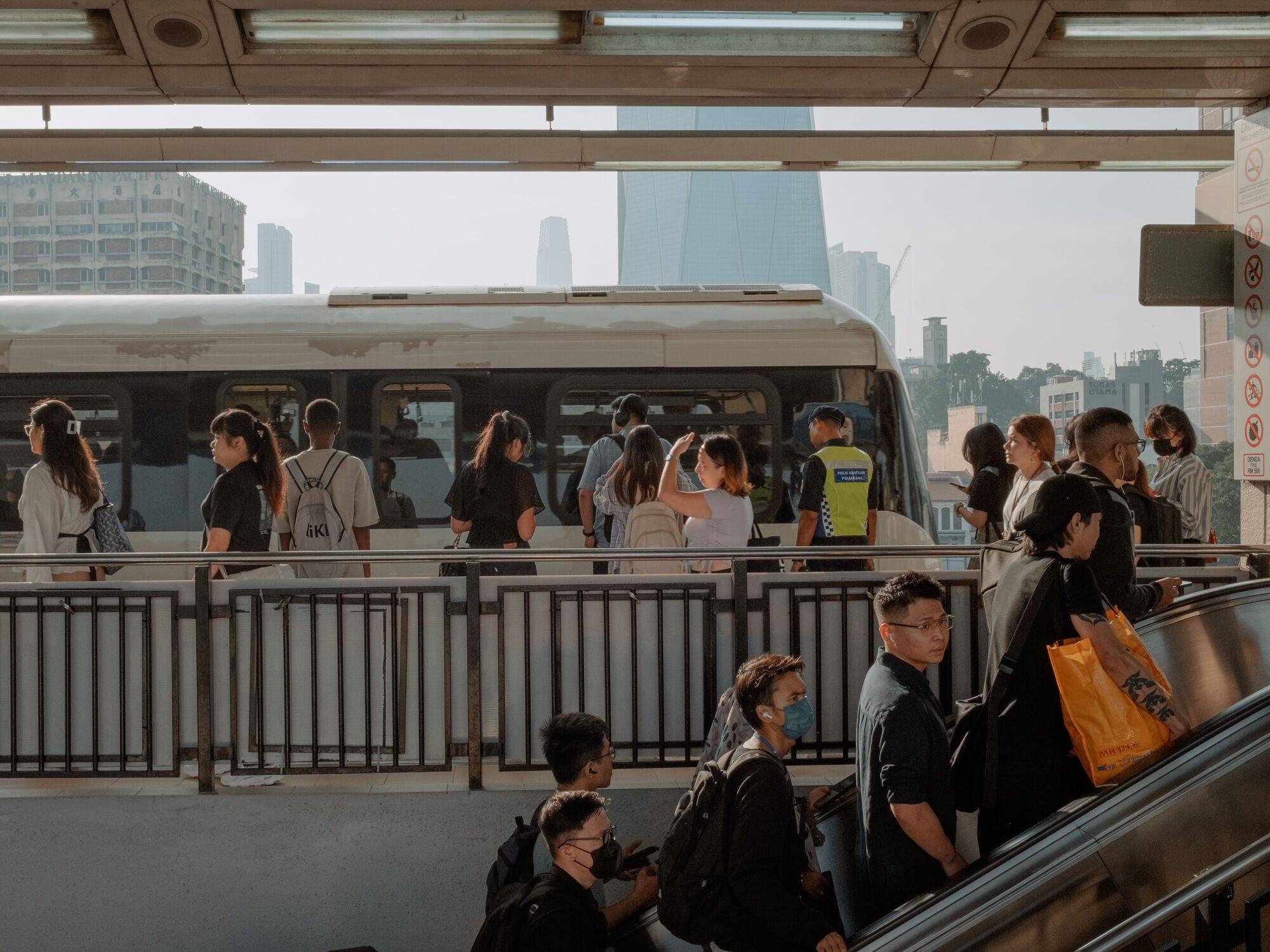 Morning commuters prepare to board a train in Kuala Lumpur earlier this month. Photo: Bloomberg