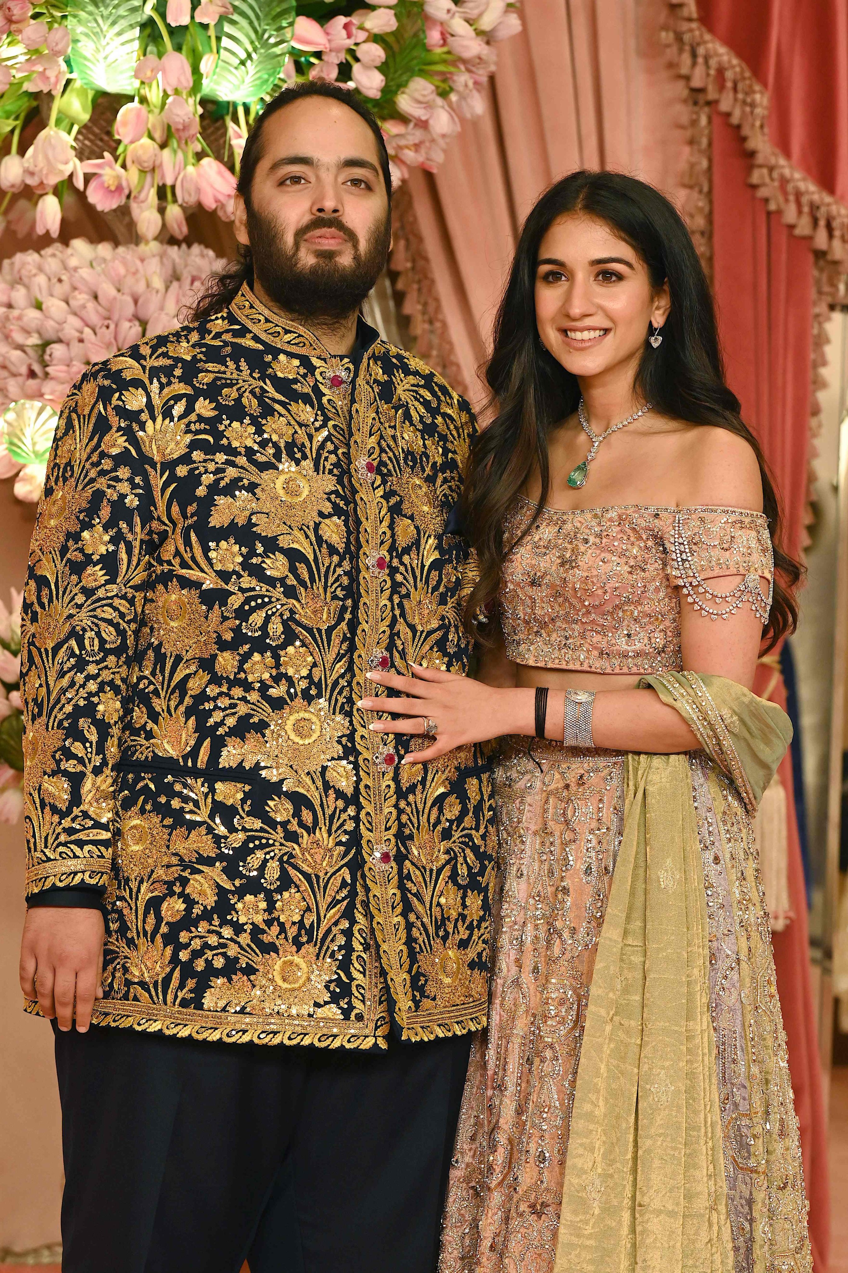 Anant Ambani, son of billionaire tycoon Mukesh Ambani, with his fiancée Radhika Merchant. Photo: AFP