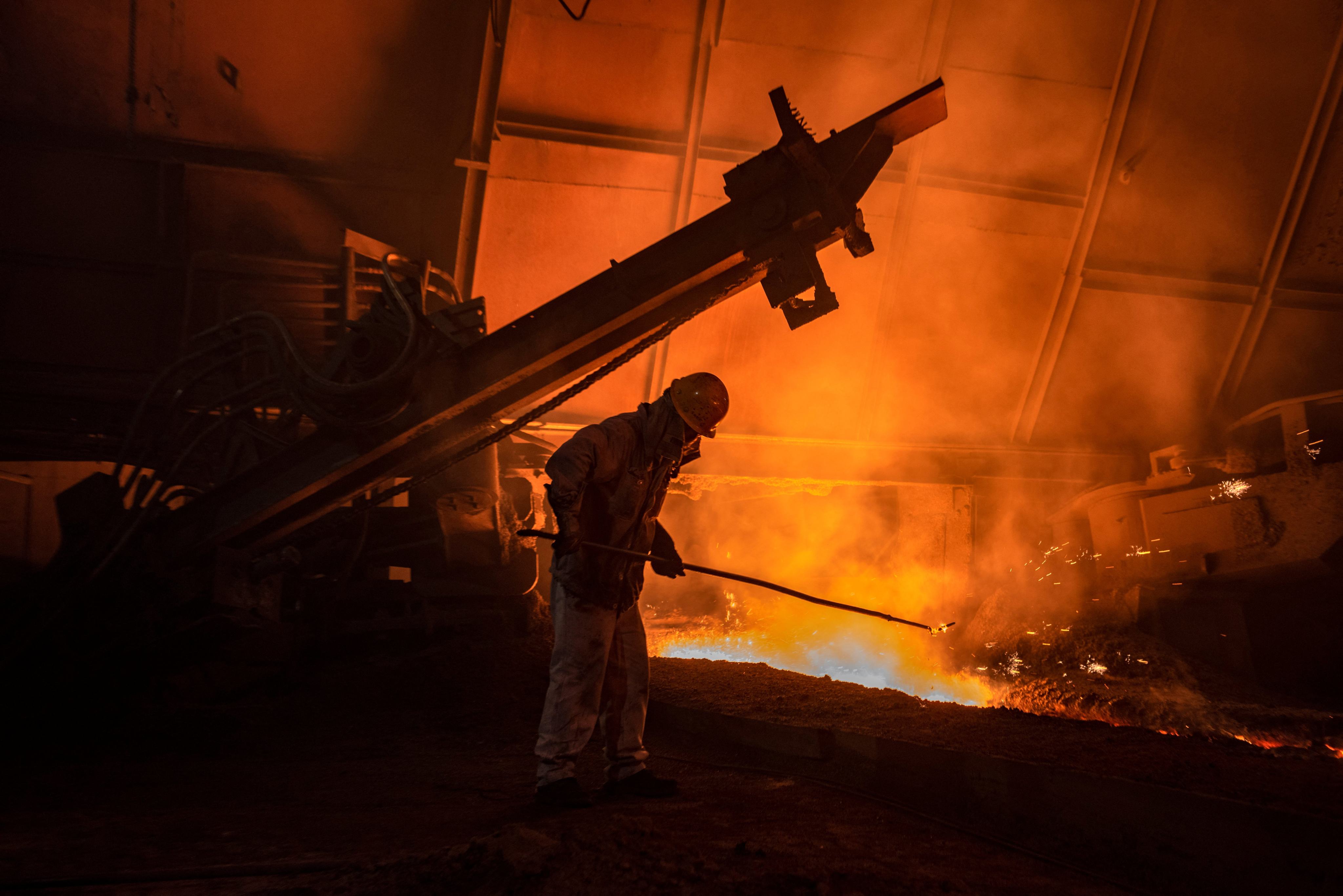 This photo taken on September 23, 2023 shows workers in a steel factory in Huaiían, in Chinaís eastern Jiangsu province. Photo:AFP