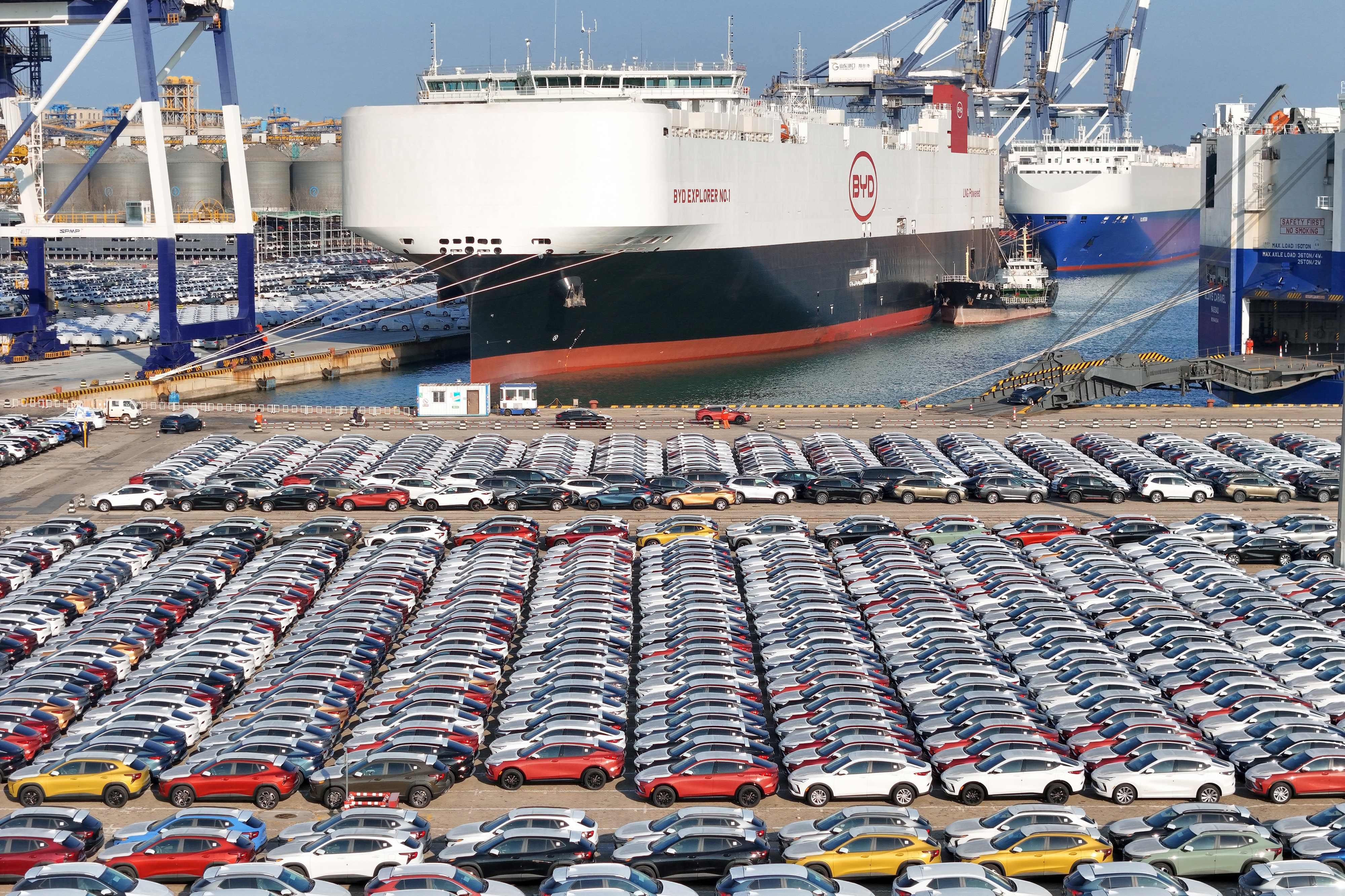 China has announced a probe into the European Union’s trade barriers.  Pictured are BYD electric vehicles ready to be loaded onto the “BYD Explorer No.1” roll-on, roll-off vehicle carrier (also pictured) for export at the port of Lianyungang in Jiangsu. Photo: AFP