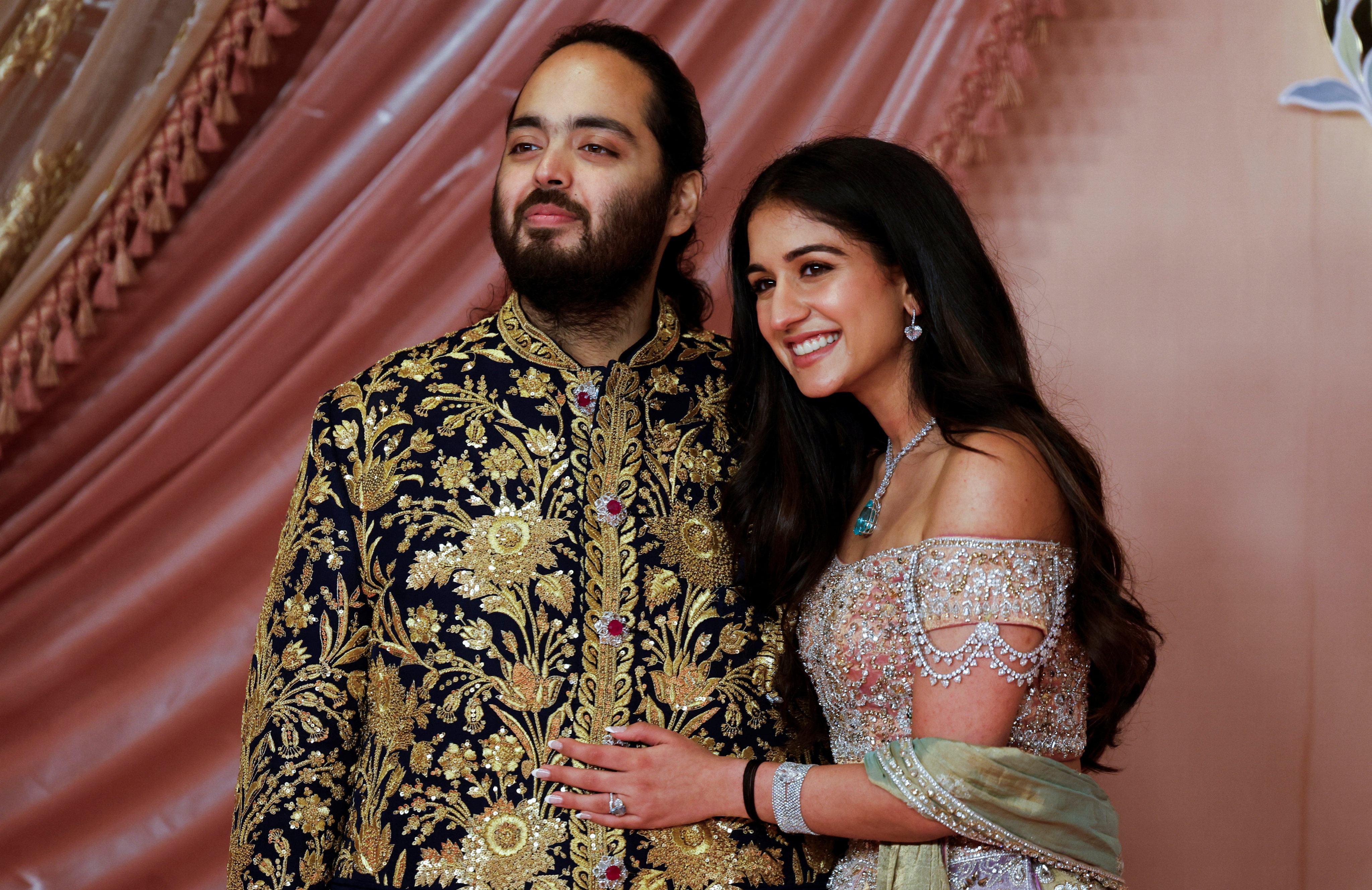 Anant Ambani with his fiancée Radhika Merchant during a ceremony in Mumbai on July 5. Photo: Reuters
