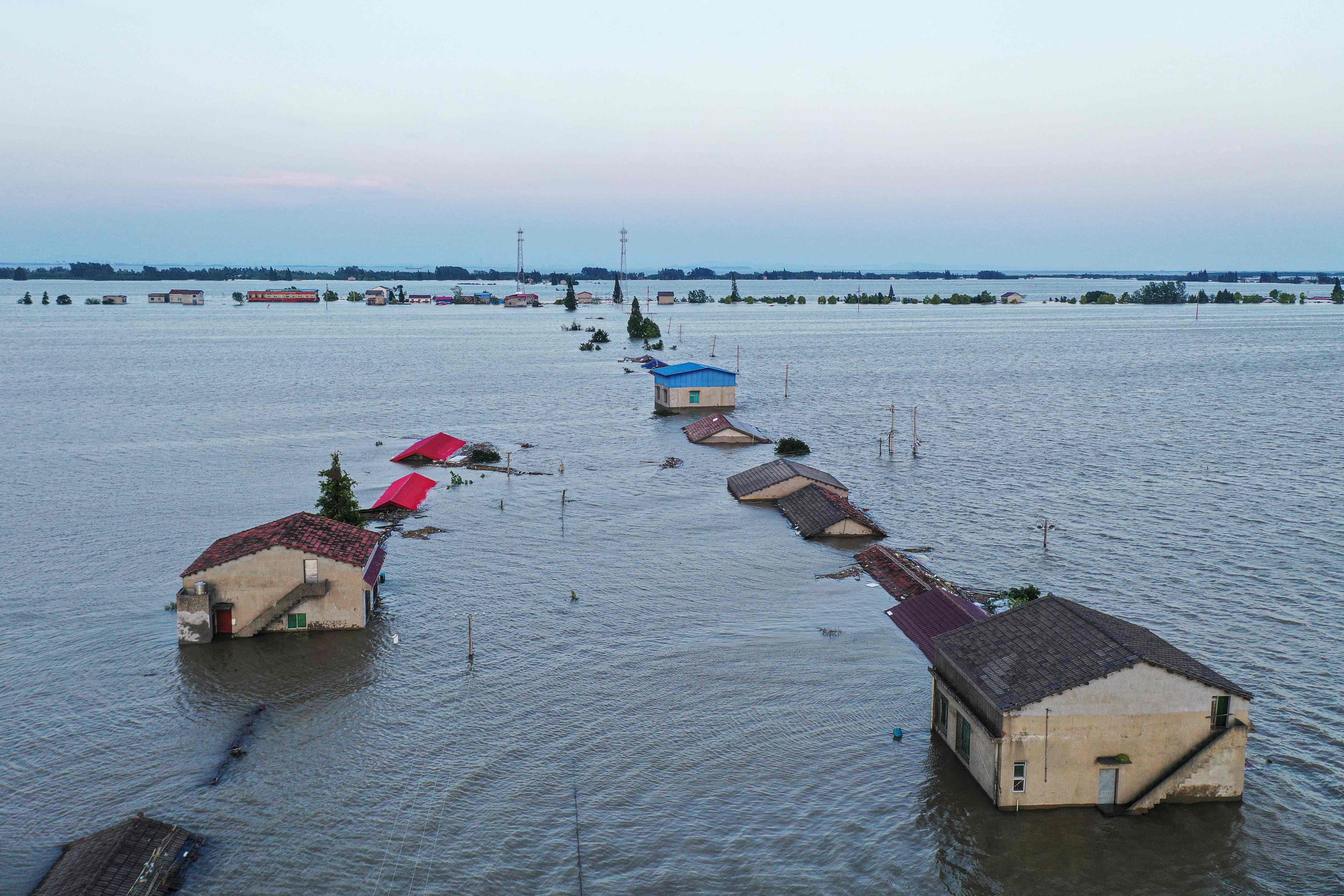 An aerial view of inundated houses during flooding caused by a dam breach in Dongting lake in Huarong county, in China’s central Hunan province. The flooding forced nearly 6,000 people to evacuate from nearby areas. Photo: AFP