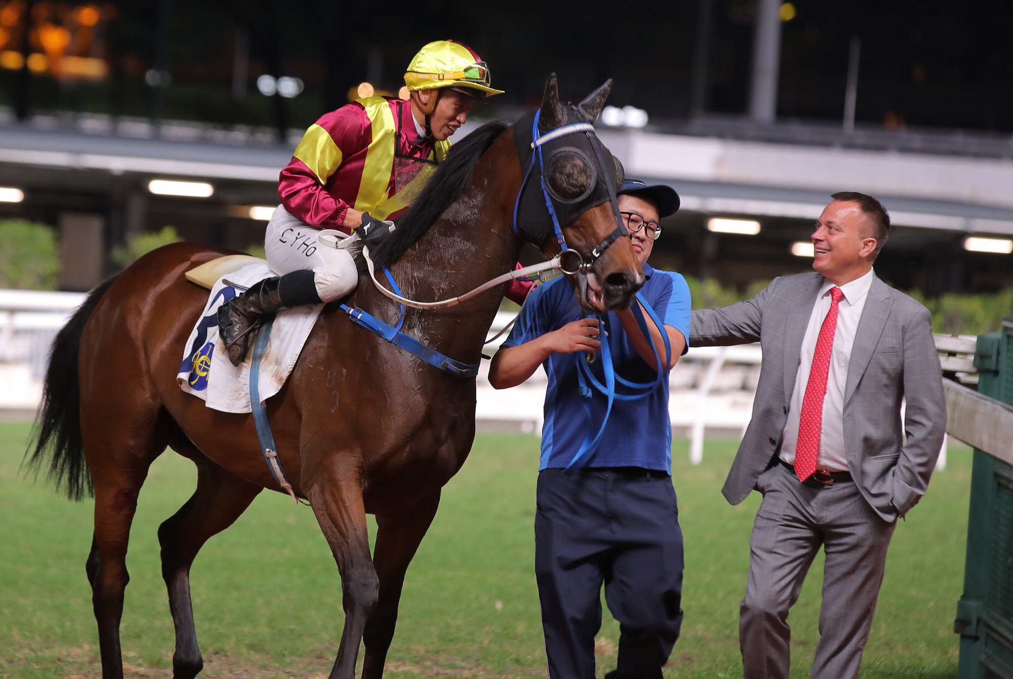 Caspar Fownes (right) and Vincent Ho (left) celebrate Camino’s remarkable win.
