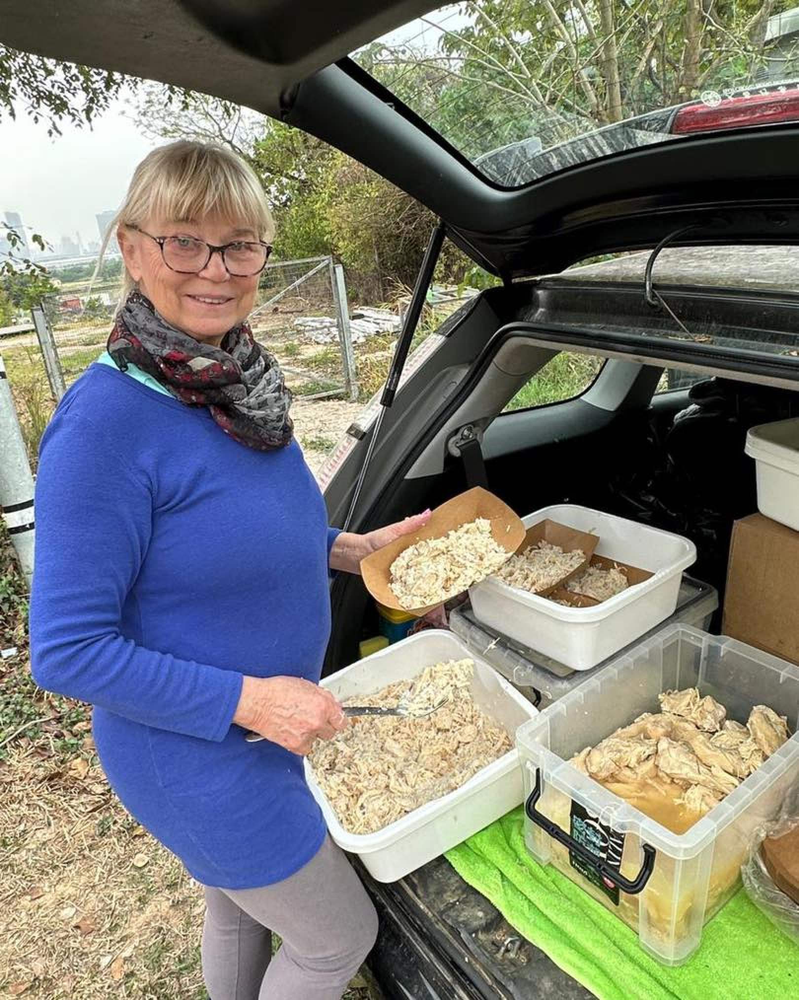 Pamuk prepares food for stray dogs near the Hong Kong-mainland China border. Photo: SKSFF