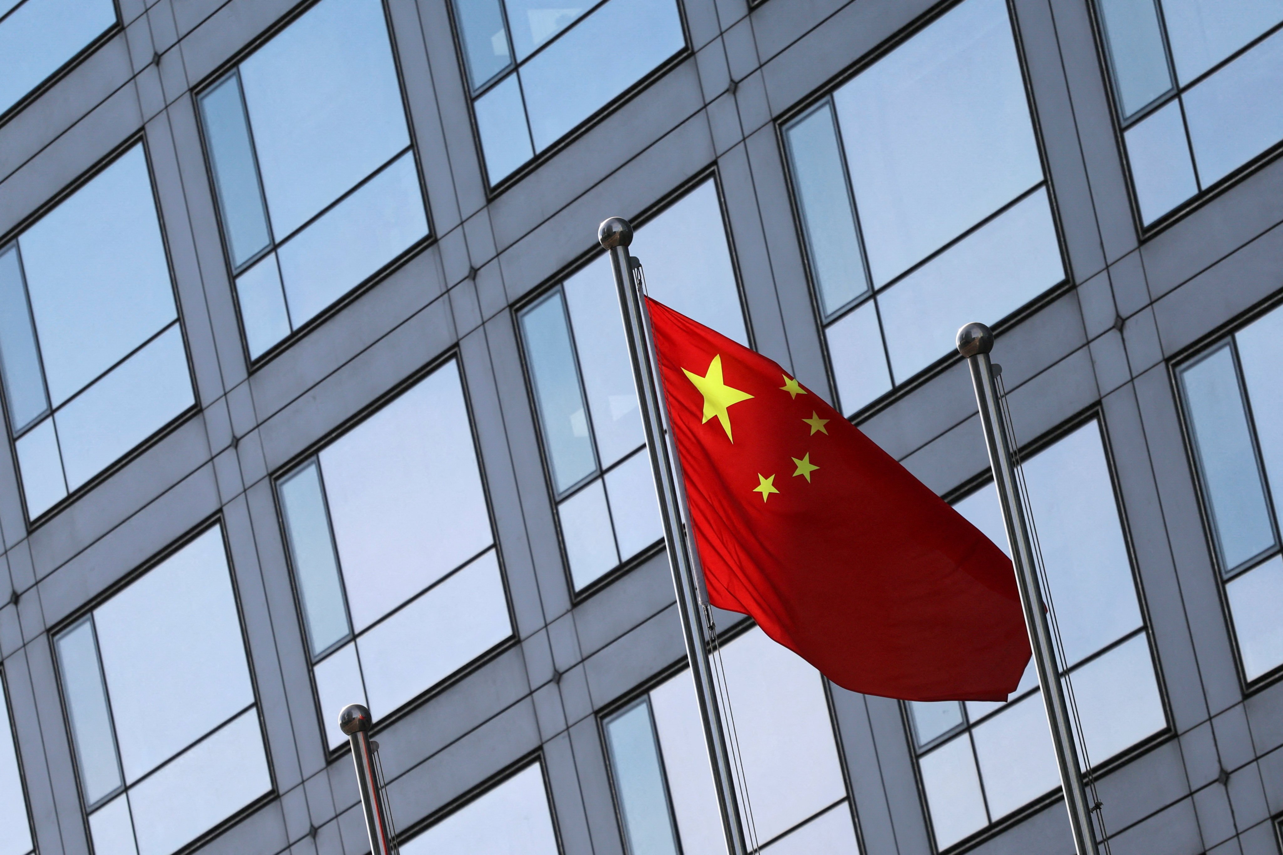 A Chinese flag flutters outside the China Securities Regulatory Commission (CSRC) building in Beijing on February 8, 2024. Photo: Reuters