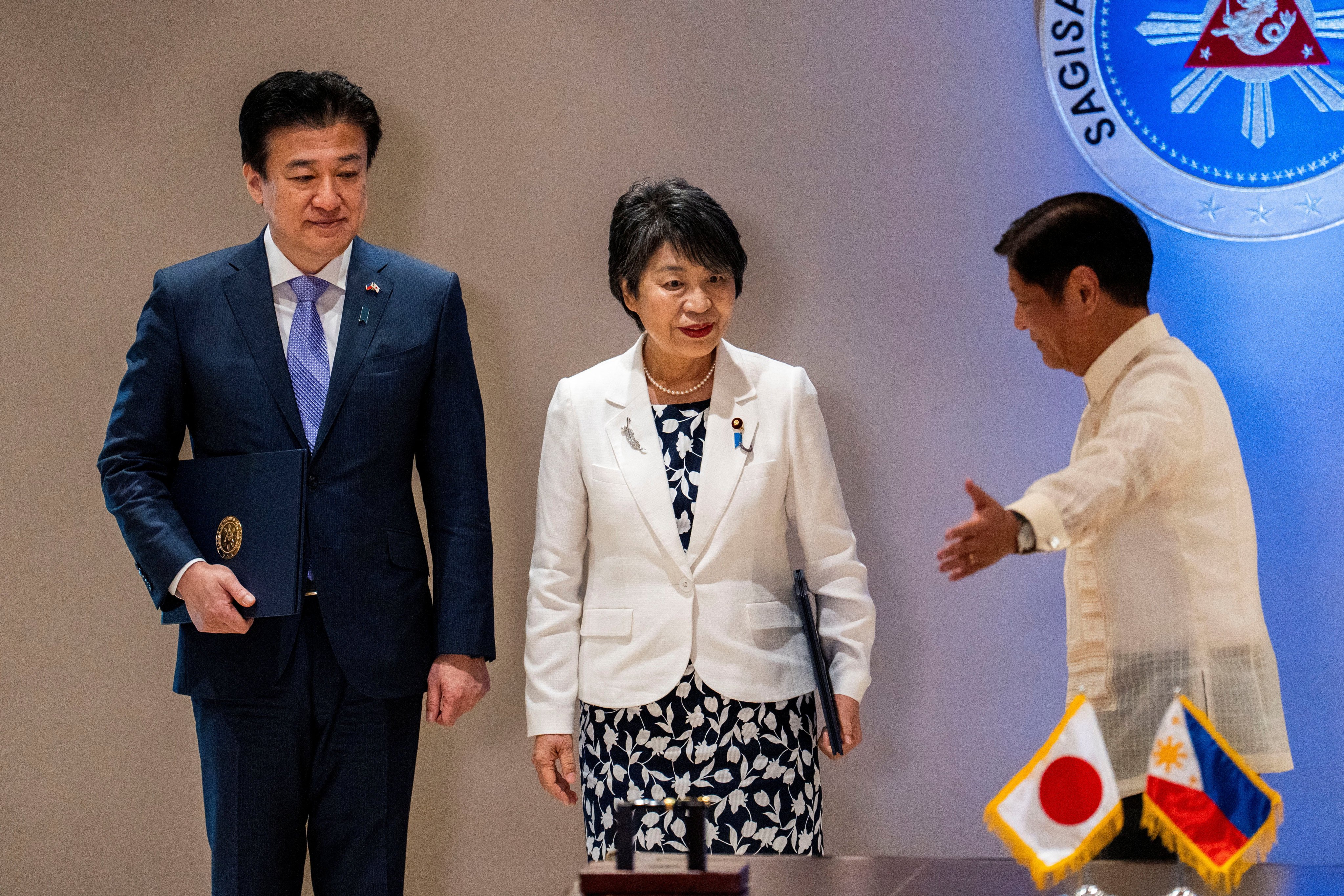Philippine President Ferdinand Marcos Jnr (right) gestures as he speaks to Japanese Defence Minister Minoru Kihara (left) and Japanese Foreign Minister Yoko Kamikawa following signing of a reciprocal access agreement between the countries, in Manila on Monday. Photo: Reuters