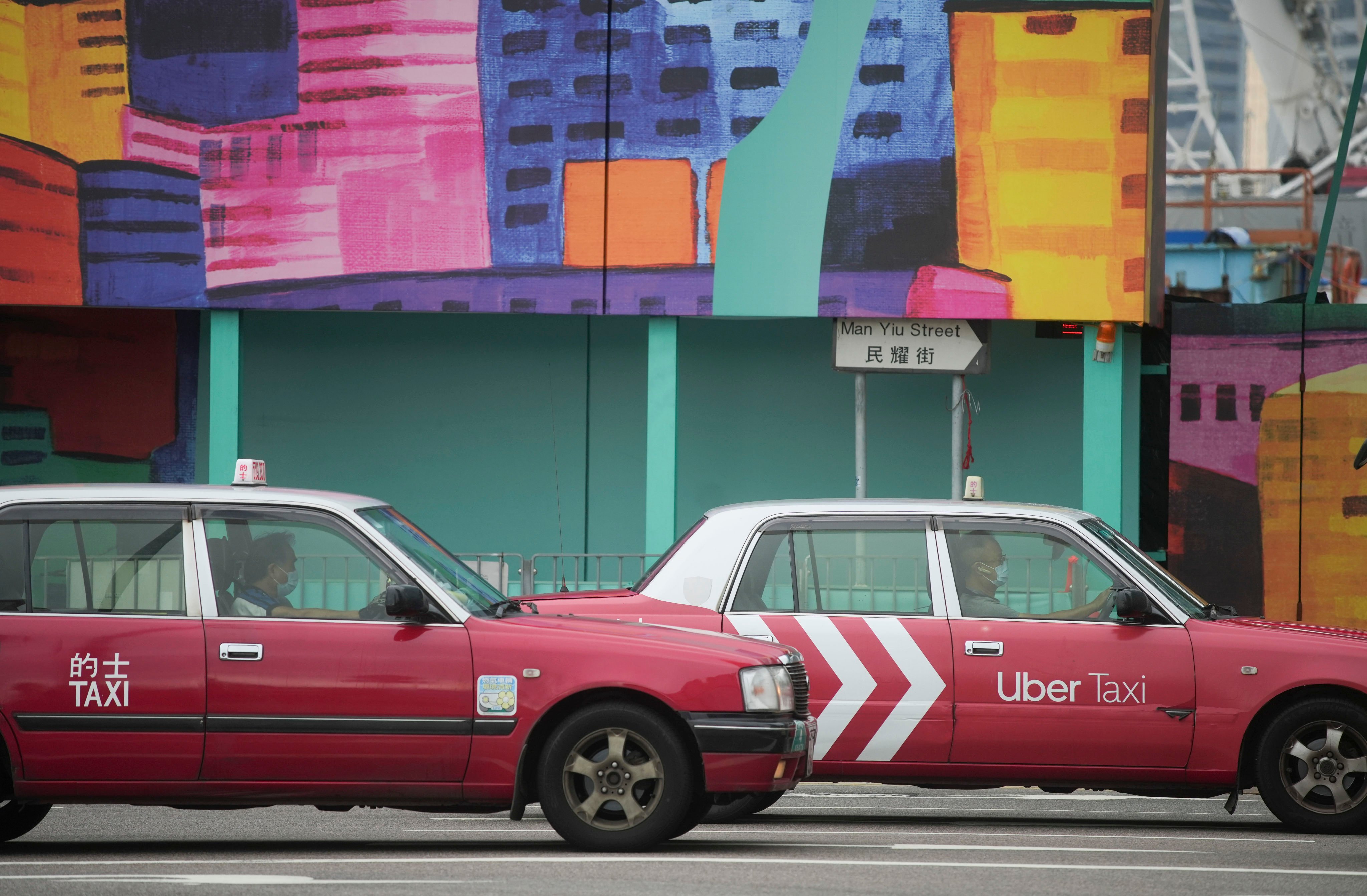 A taxi overtakes another near a construction site in Central on May 30. Photo: Sun Yeung