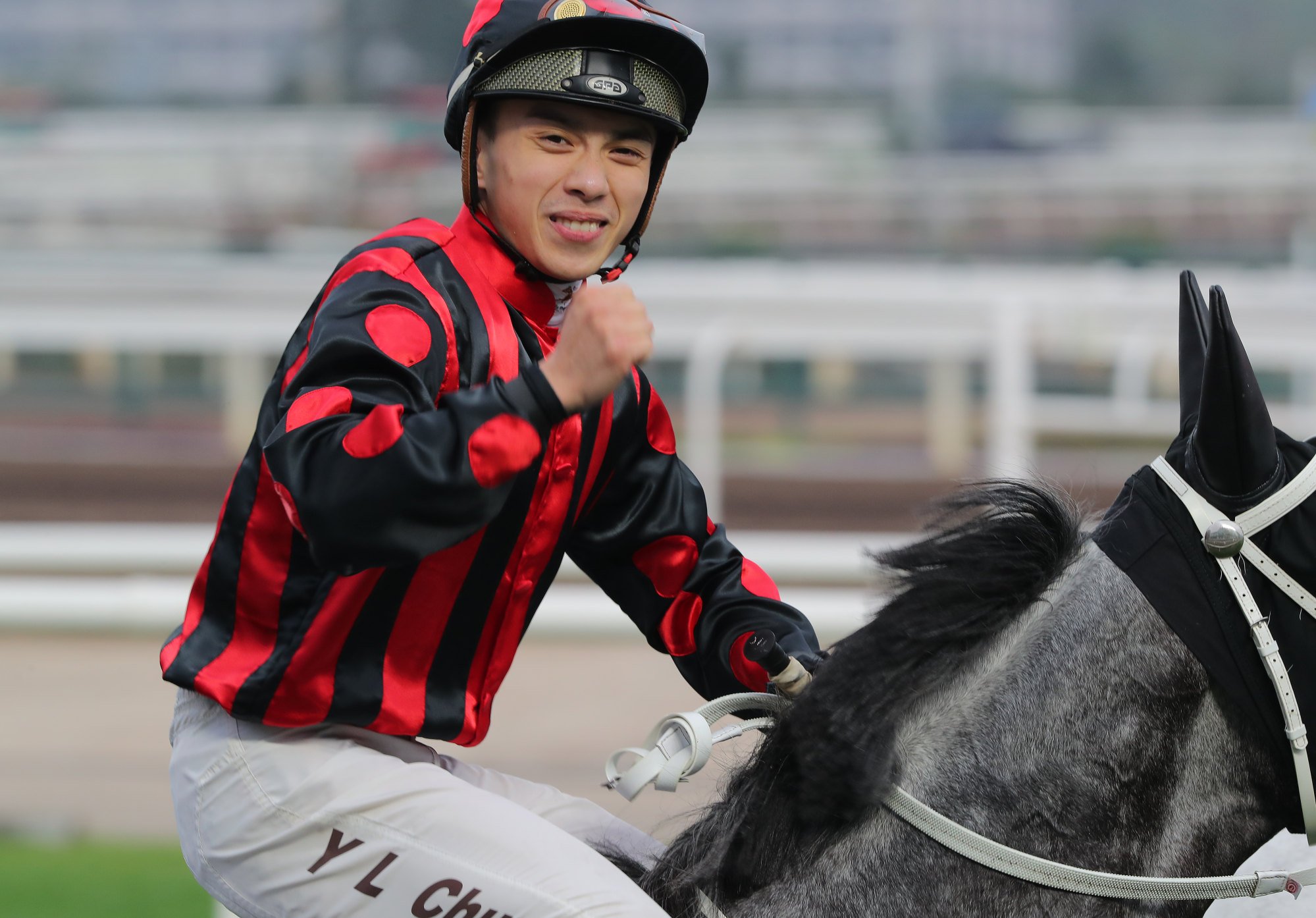 Angus Chung celebrates riding a double at Sha Tin in March.