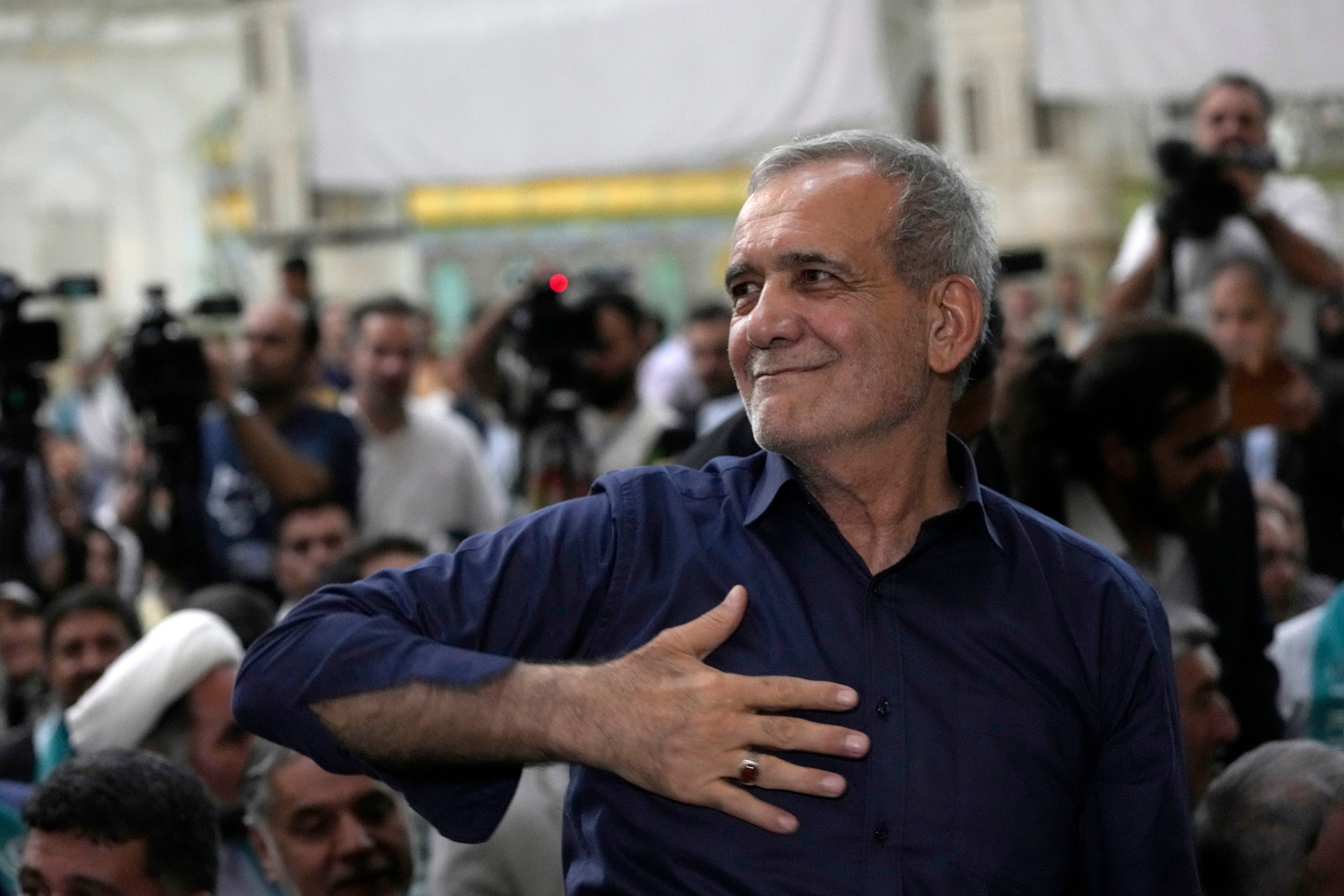 Iran’s president-elect Masoud Pezeshkian greets supporters a day after the election at the shrine of the late revolutionary founder Ayatollah Khomeini just outside Tehran. Photo: AP