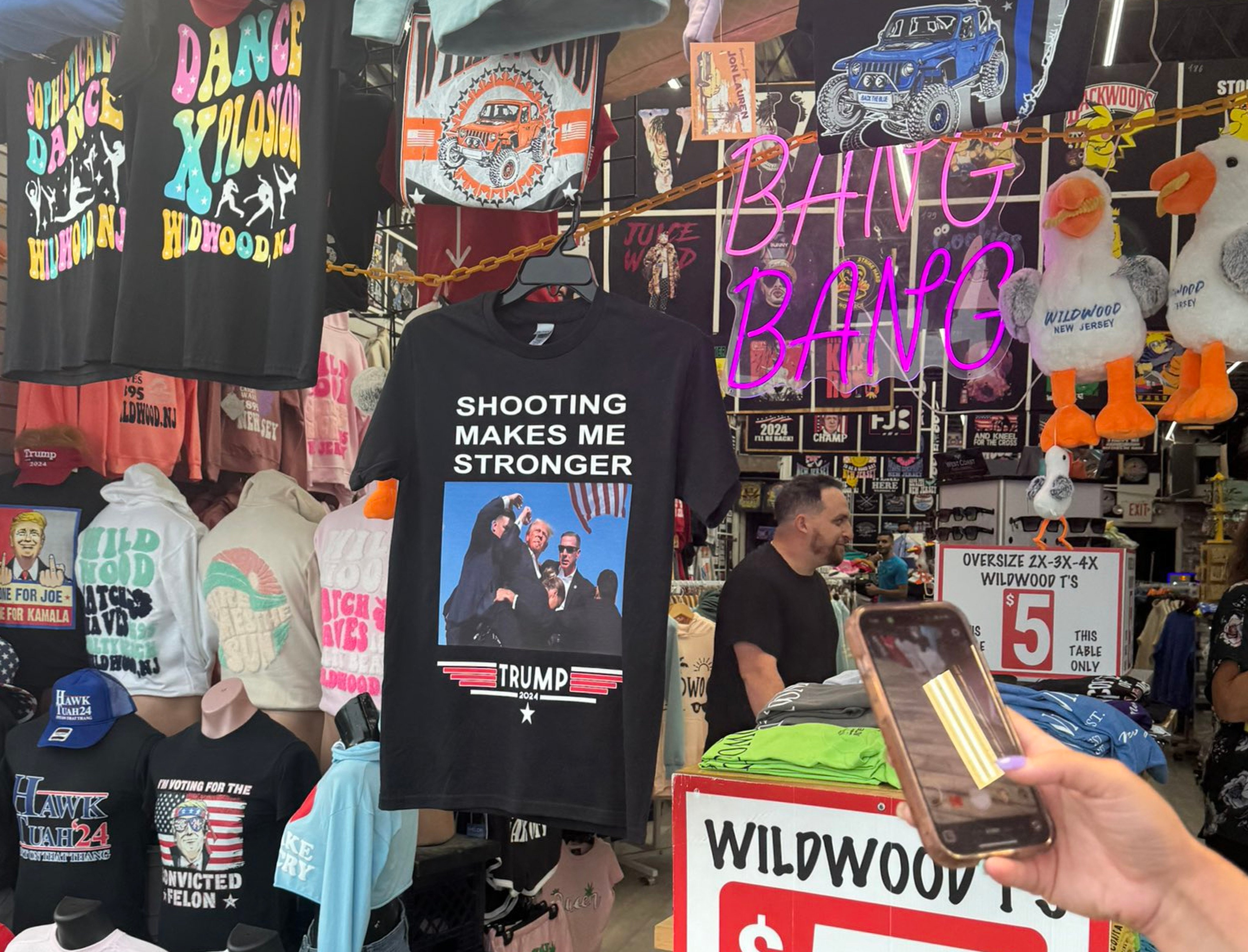 T-shirts printed with an injured Donald Trump raising his fist on sale at a New Jersey boardwalk. Photo: X/ @ThaDietz_