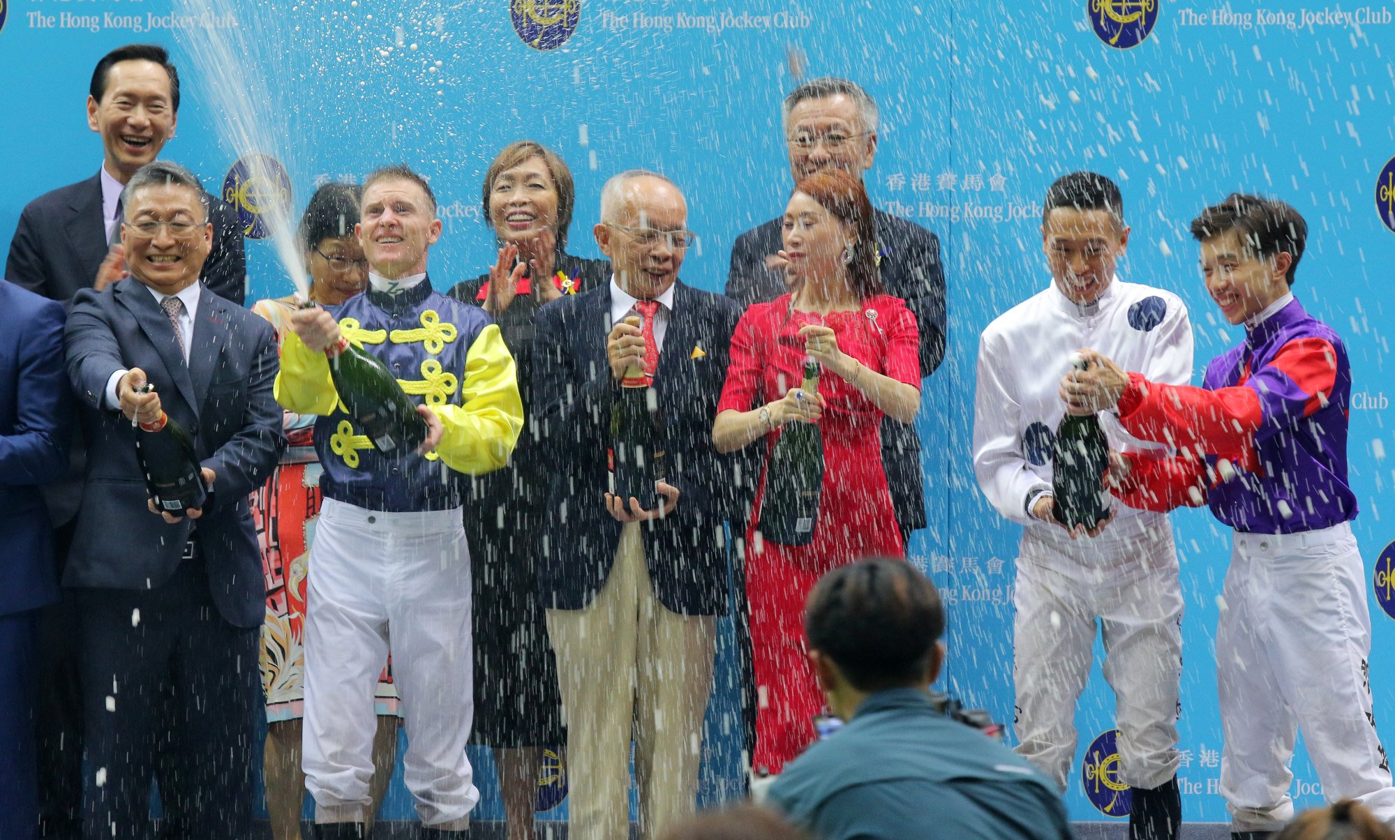 Zac Purton (second from left) celebrates his seventh jockeys’ championship win.