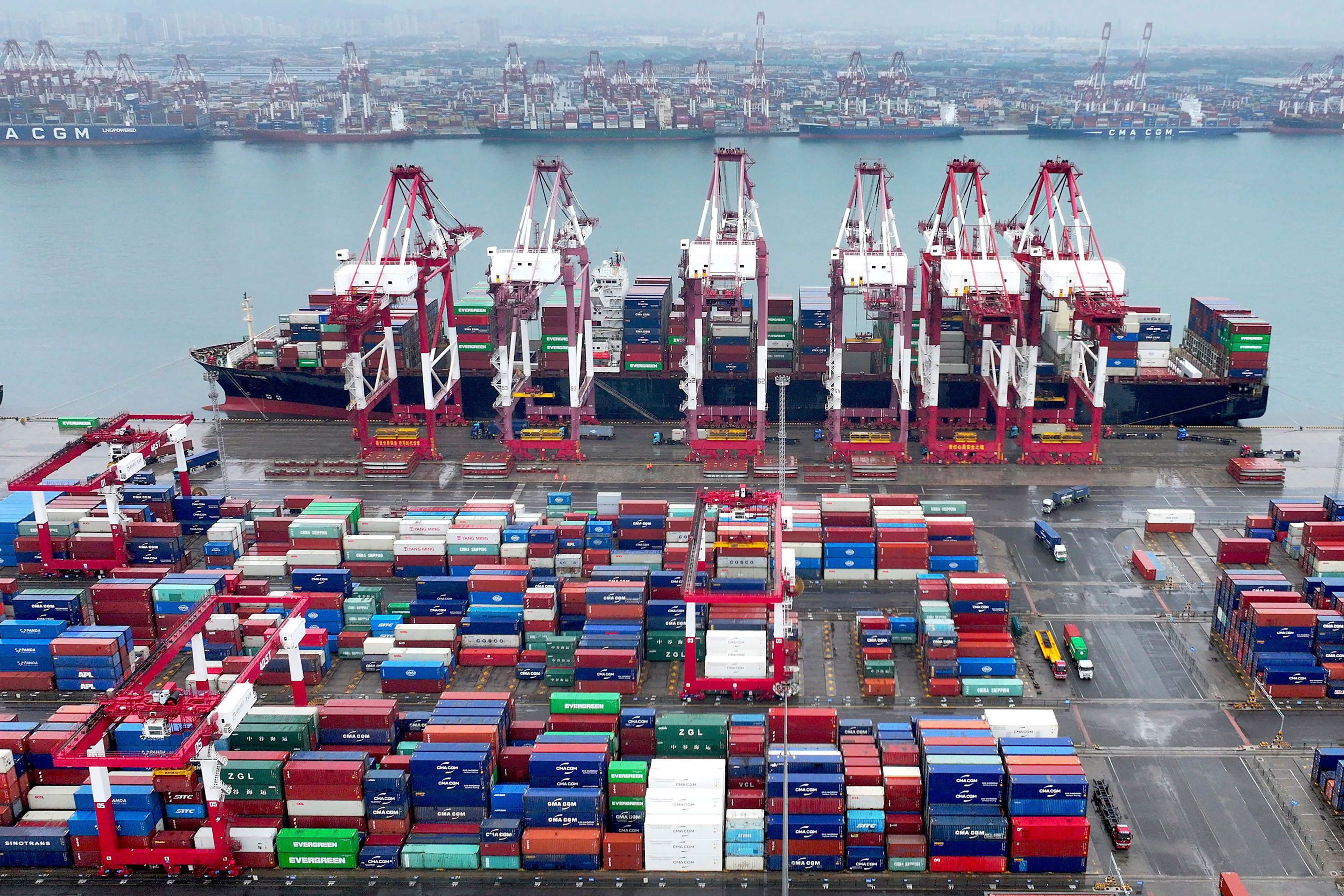 Cranes and transporters work at an automated container port in Qingdao in eastern China’s Shandong province on July 7. The IMF has warned of increasing signs of fragmentation, noting that trade and investment flows are being directed along geopolitical lines. Photo: Chinatopix via AP