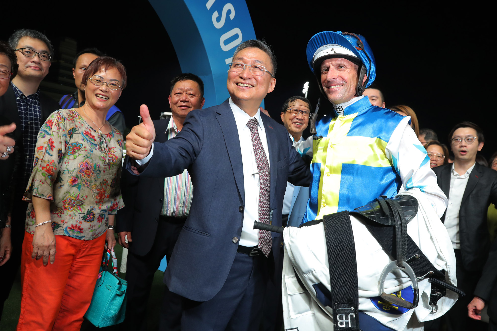 Francis Lui celebrates Patch Of Theta’s win with jockey Hugh Bowman and connections.