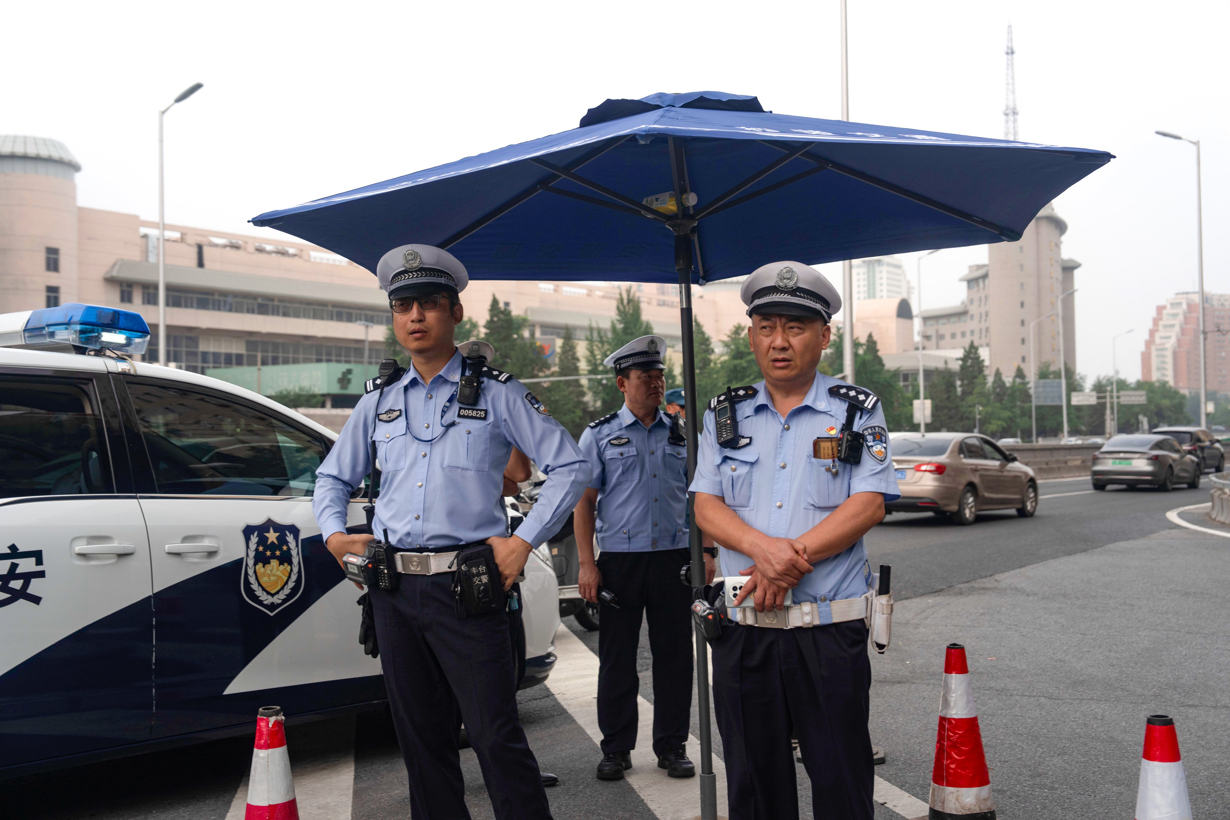 Traffic police officers monitor a road leading towards the Jingxi Hotel where the Communist Party’s Central Committee is holding its third plenum in Beijing, China, on Monday, July 15, 2024. Photo: AP