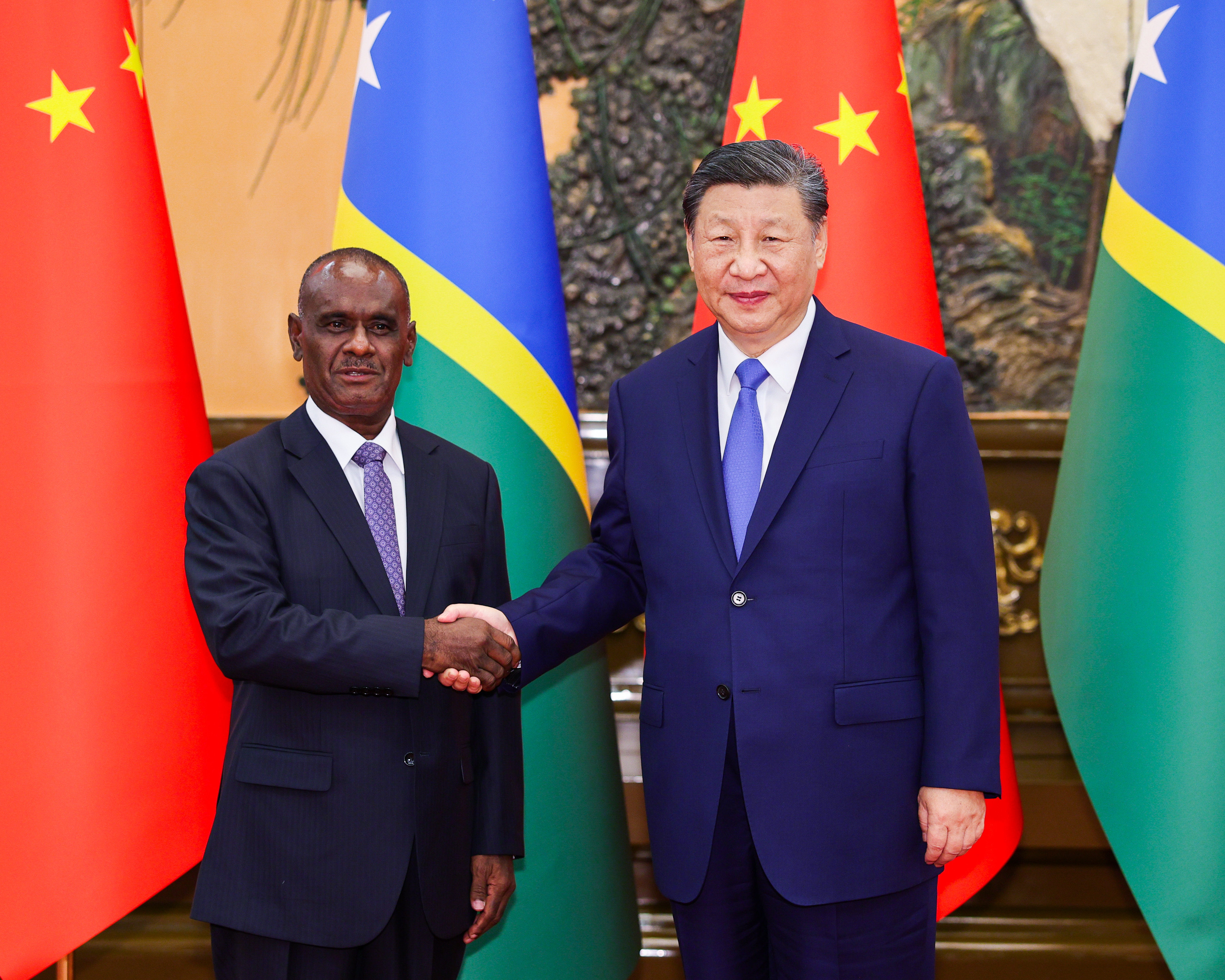 Chinese President Xi Jinping shakes hands with Solomon Islands Prime Minister Jeremiah Manele in Beijing on July 12. Photo: Xinhua