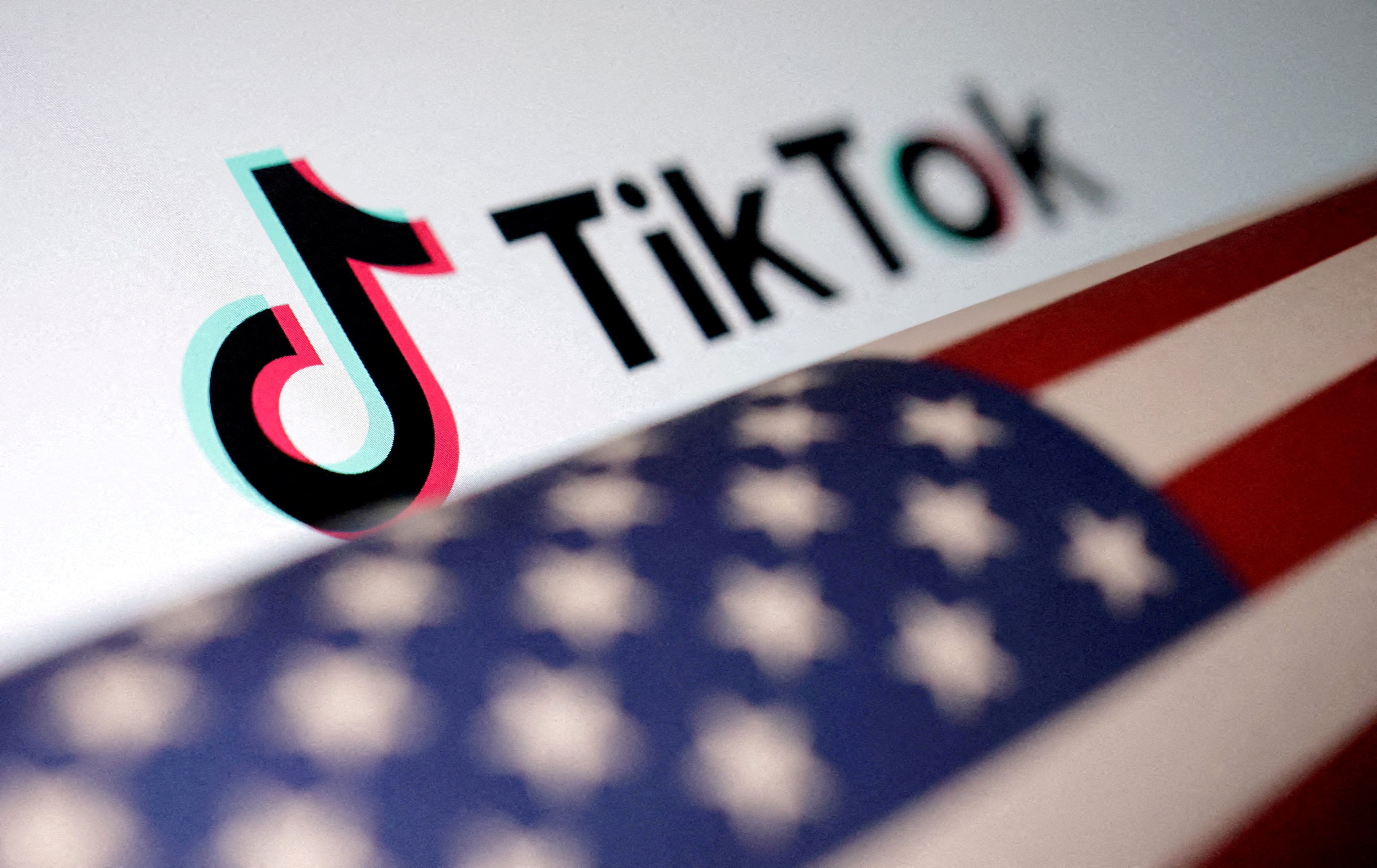 U.S. flag is placed on a TikTok logo in this illustration taken March 20, 2024. Republican presidential candidate Donald Trump said he supports TikTok. Photo: Reuters