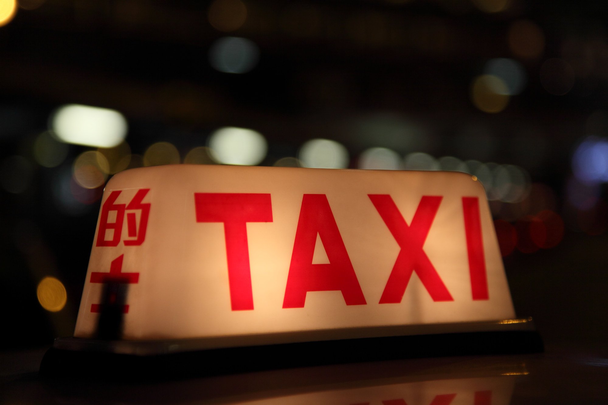 Police intercept the taxi at Lai Kok Estate in Sham Shui Po district during an anti-narcotics operation on Tuesday night. Photo: Shutterstock