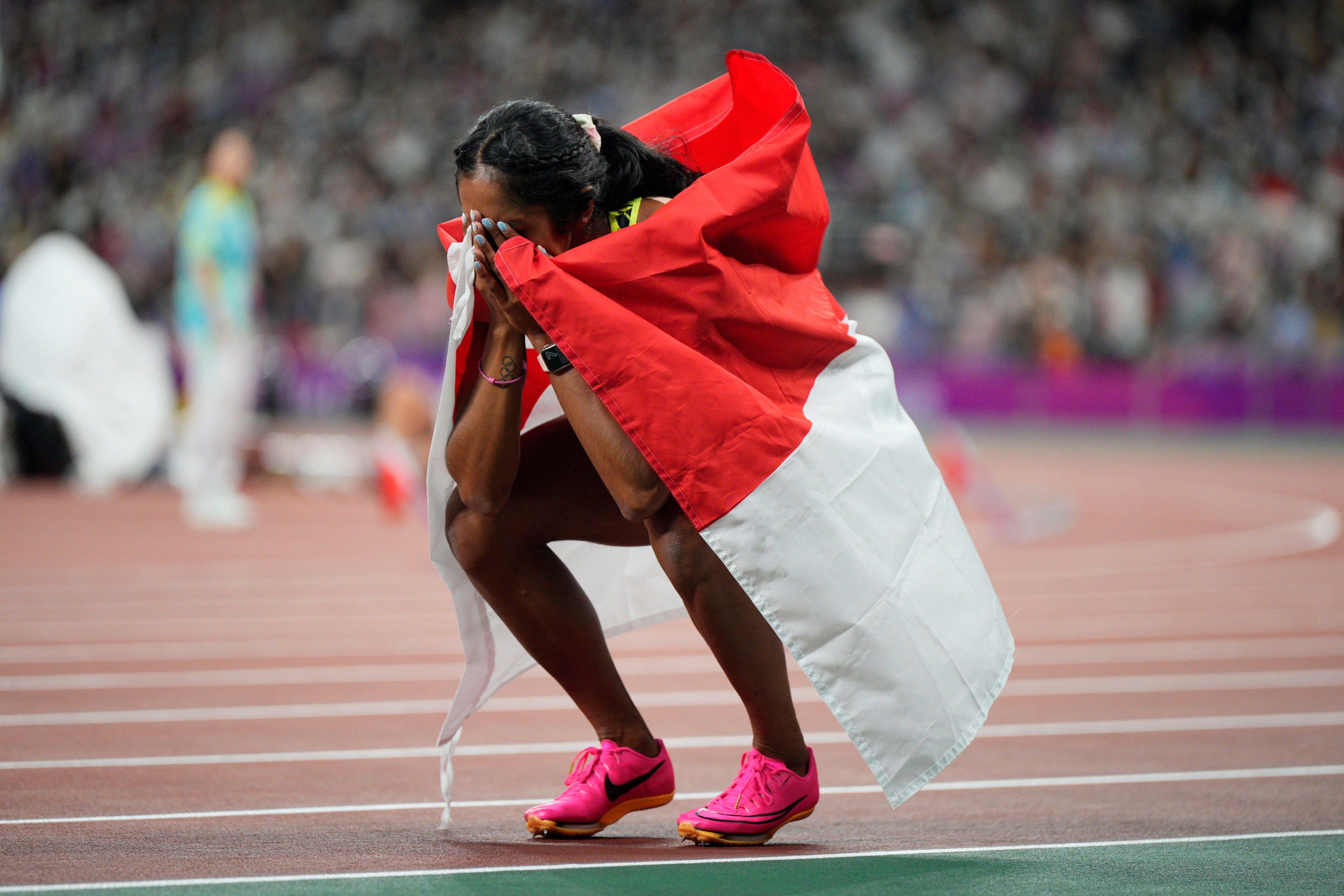 Singapore’s Shanti Pereira is overcome after winning 200m gold at the Asian Games in 2023. Photo: AP