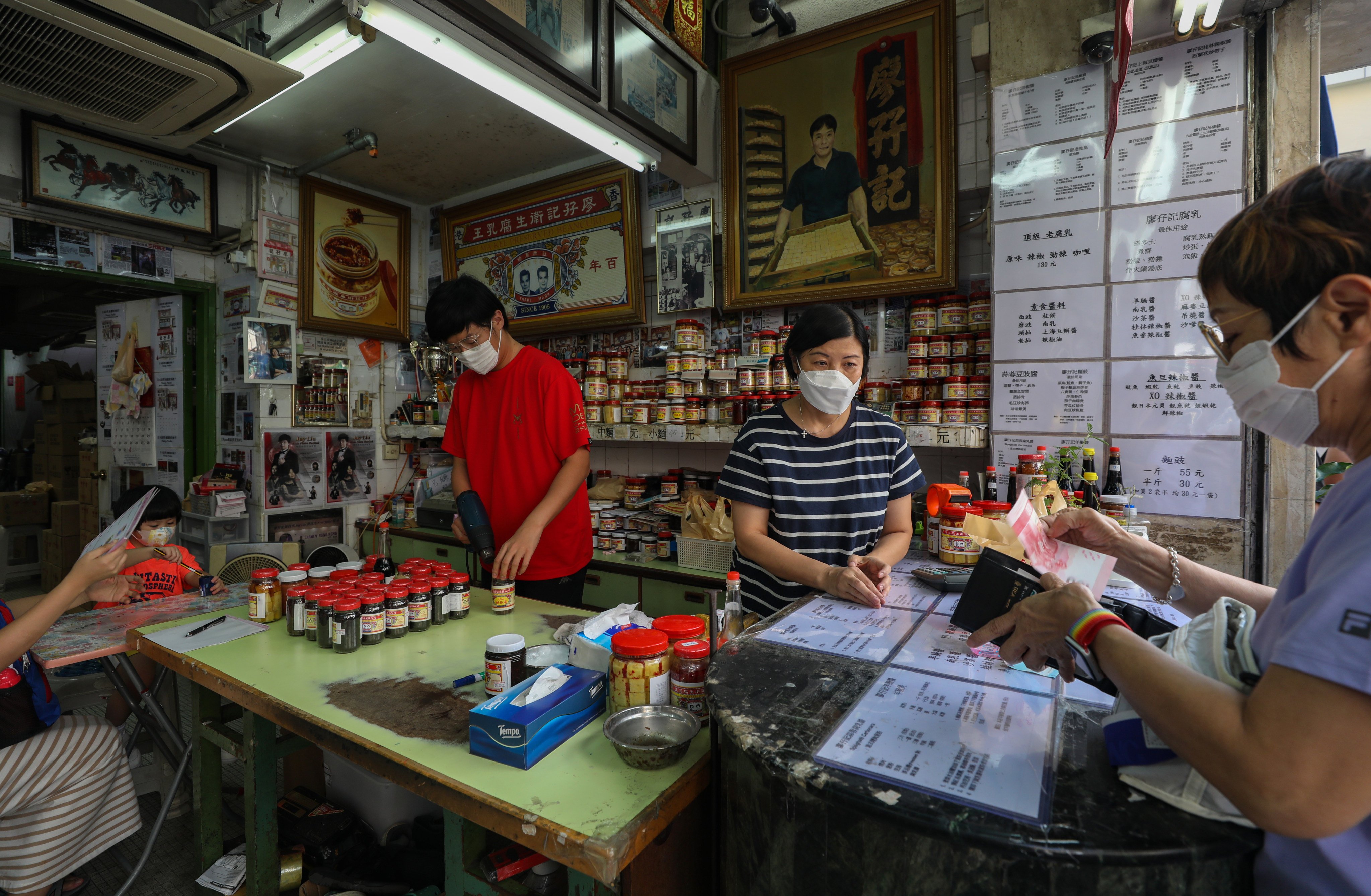 Jay Liu Fong-yip (left) is the fourth generation of his family to work at Liu Ma Kee, a fermented tofu shop founded in 1905 in Hong Kong’s Yau Ma Tei neighbourhood. Photo: Xiaomei Chen