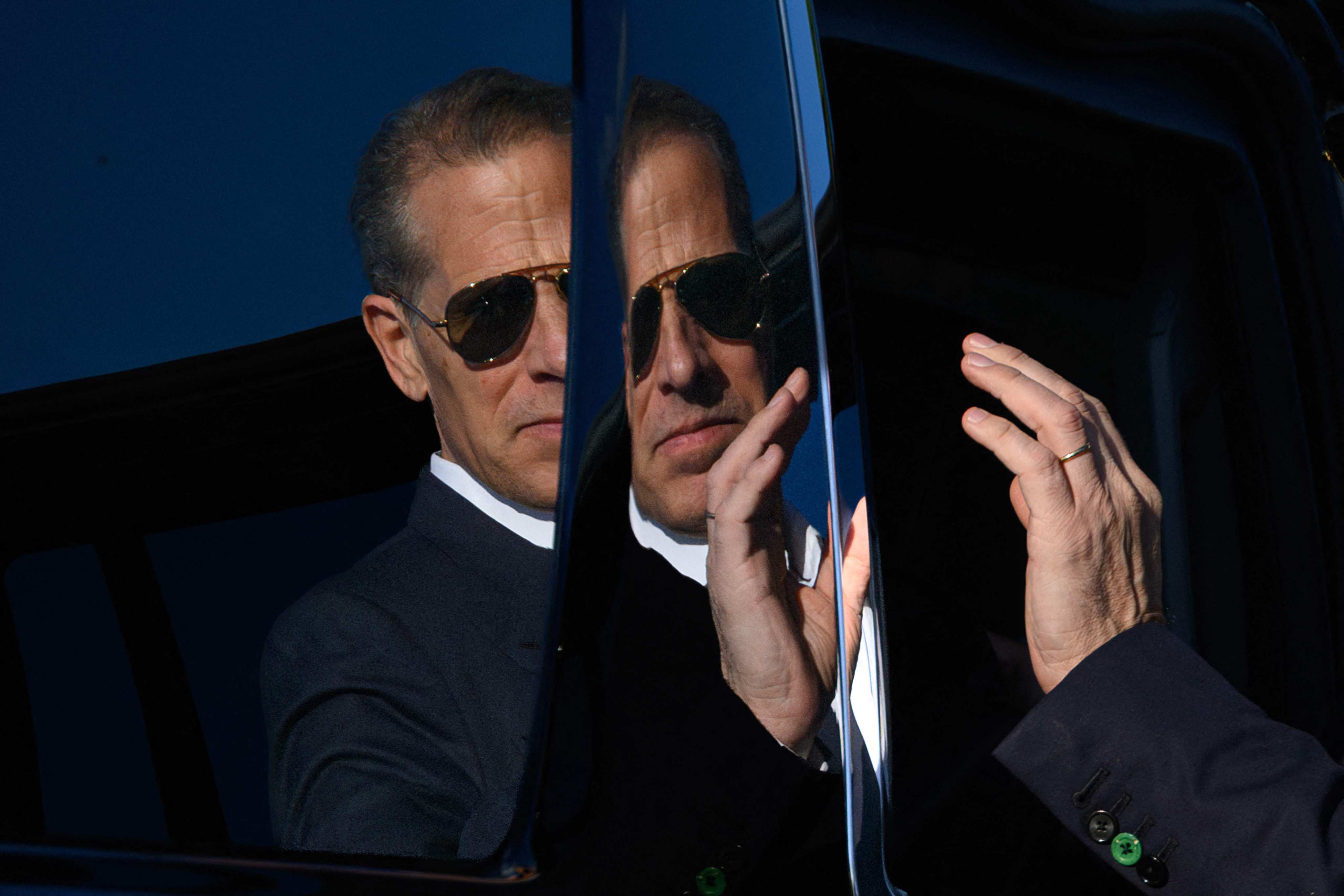 Hunter Biden’s reflection is seen on a car in Washington on July 1. Photo: AFP