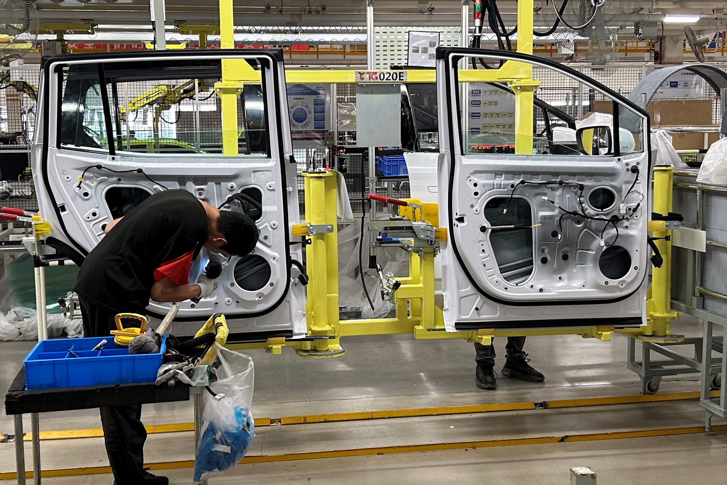 Employees work on an electric-vehicle production line at a factory under Jiangling Group Electric Vehicle in Nanchang, China, on May 22, 2024. The European Union this week imposed provisional tariffs on Chinese-made EVs. Photo: Reuters