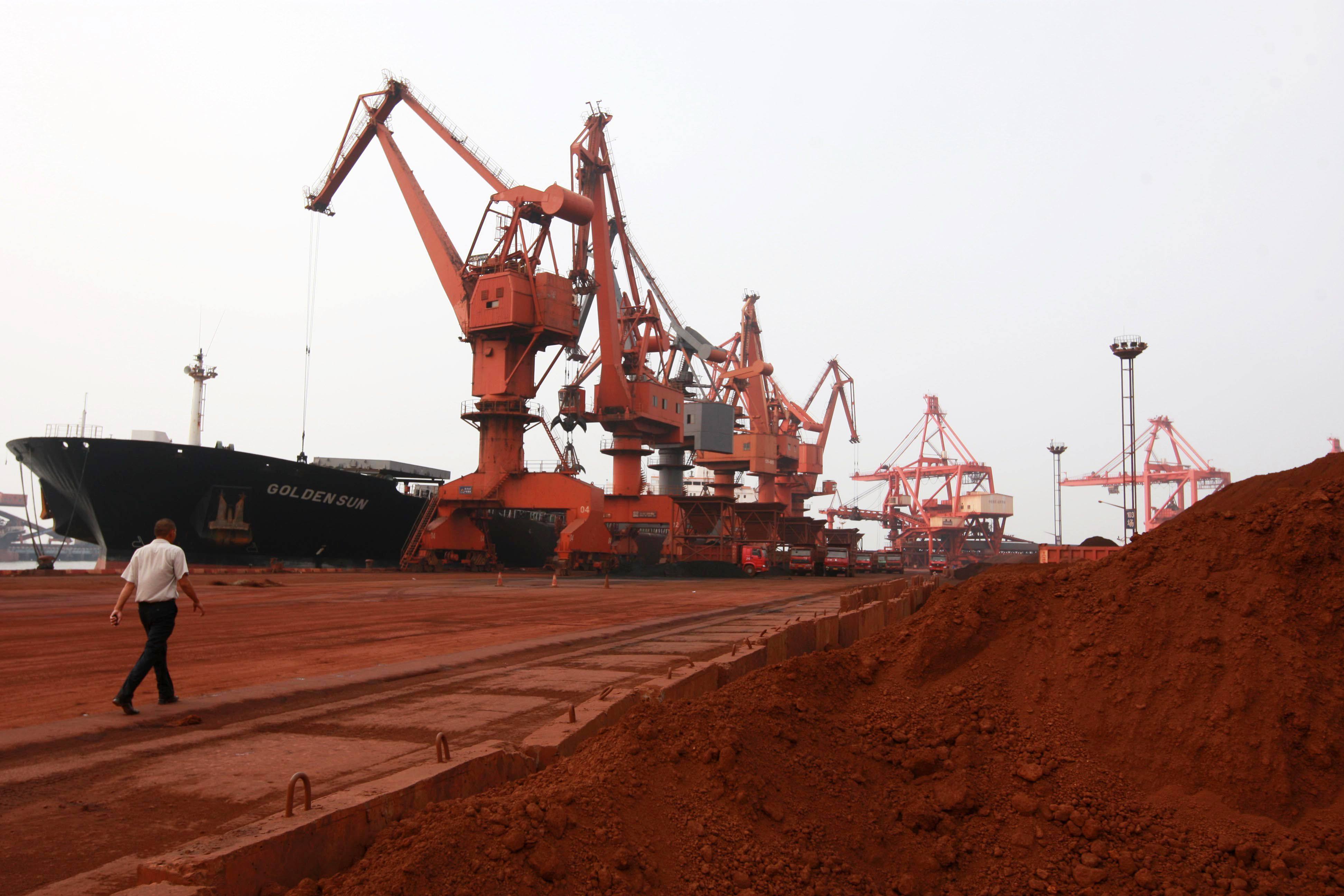 Bulldozer scoop soil containing various rare earth to be loaded on to a ship at a port in Lianyungang, Jiangsu province, for export to Japan. Photo: AFP