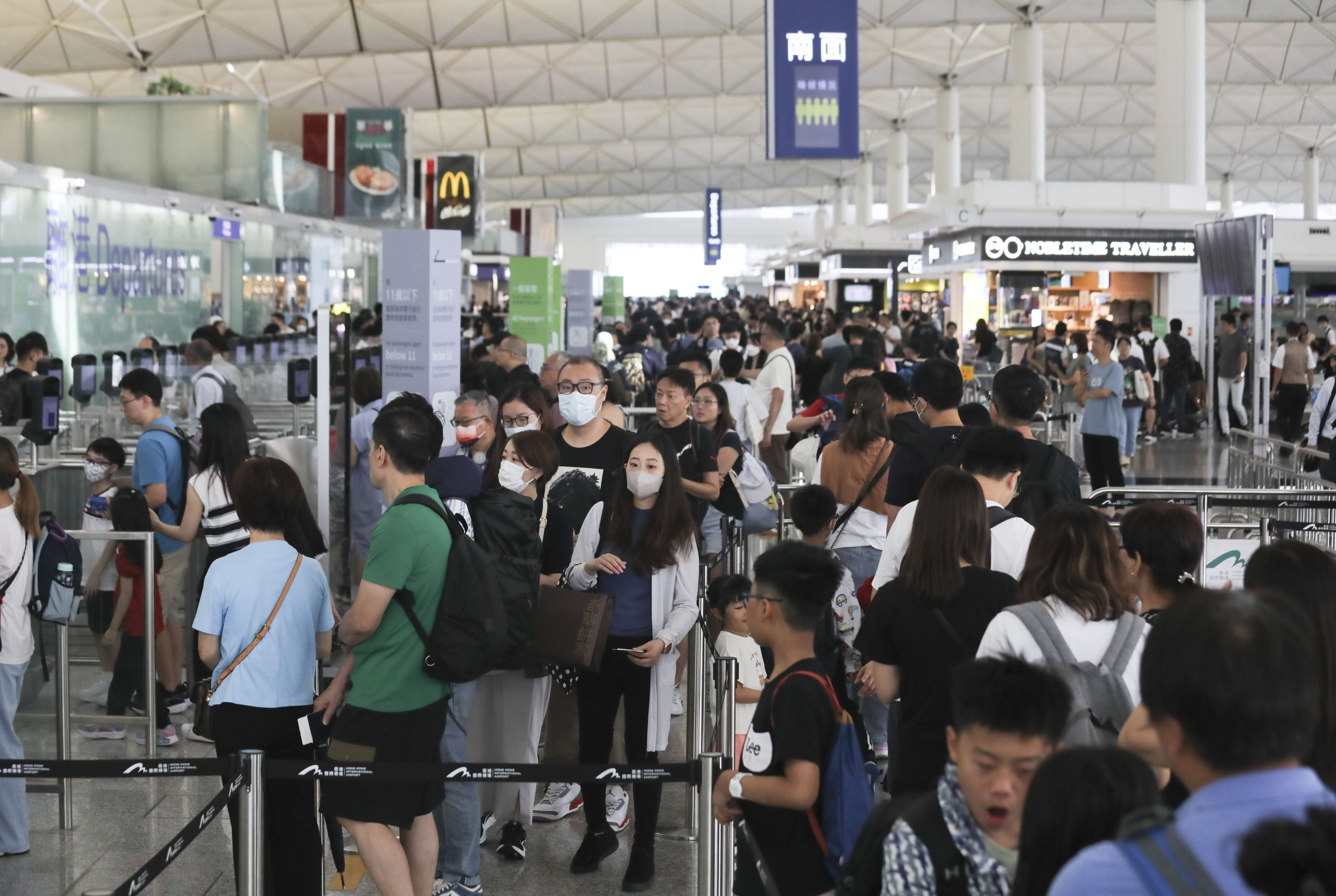 The city’s airport services slowed to a crawl when airlines were forced to resort to processing passengers manually. Photo: Xiaomei Chen