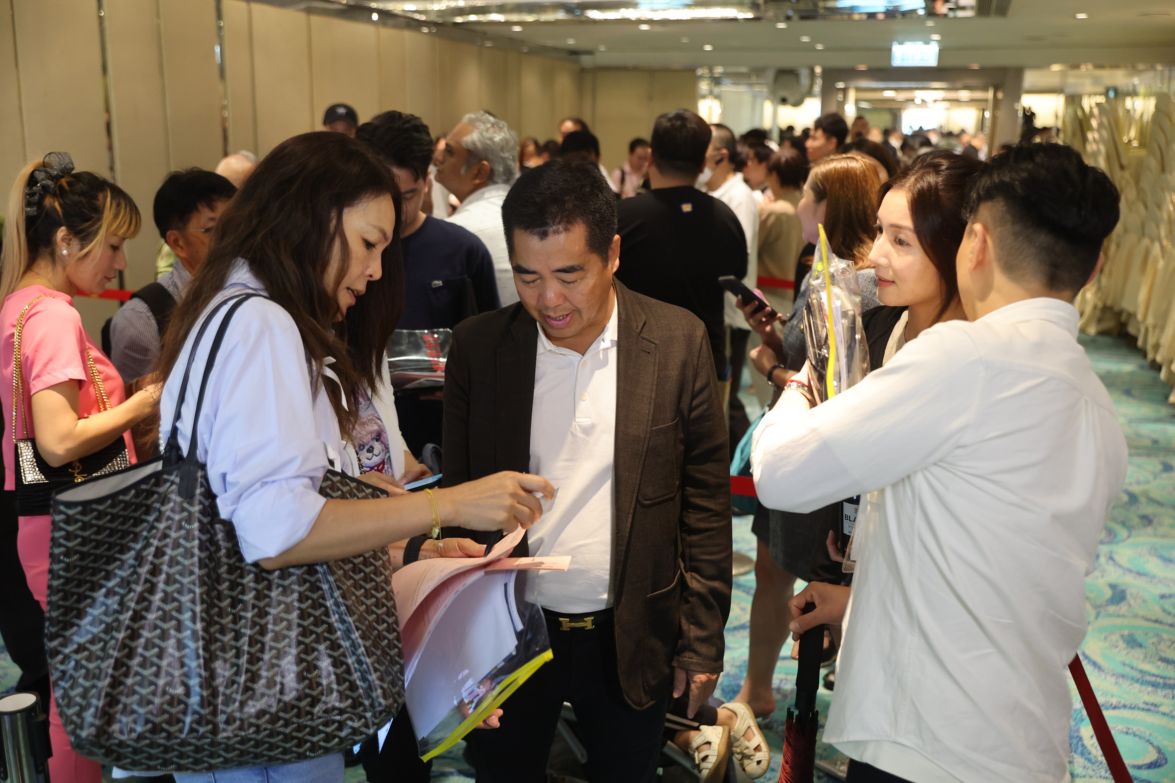 Property buyers for Tuen Mun’s The Uppland apartments flock to the sales office of Early Light International at the Regal Kowloon Hotel in Tsim Sha Tsui on July 20, 2024. Photo: Edmond So