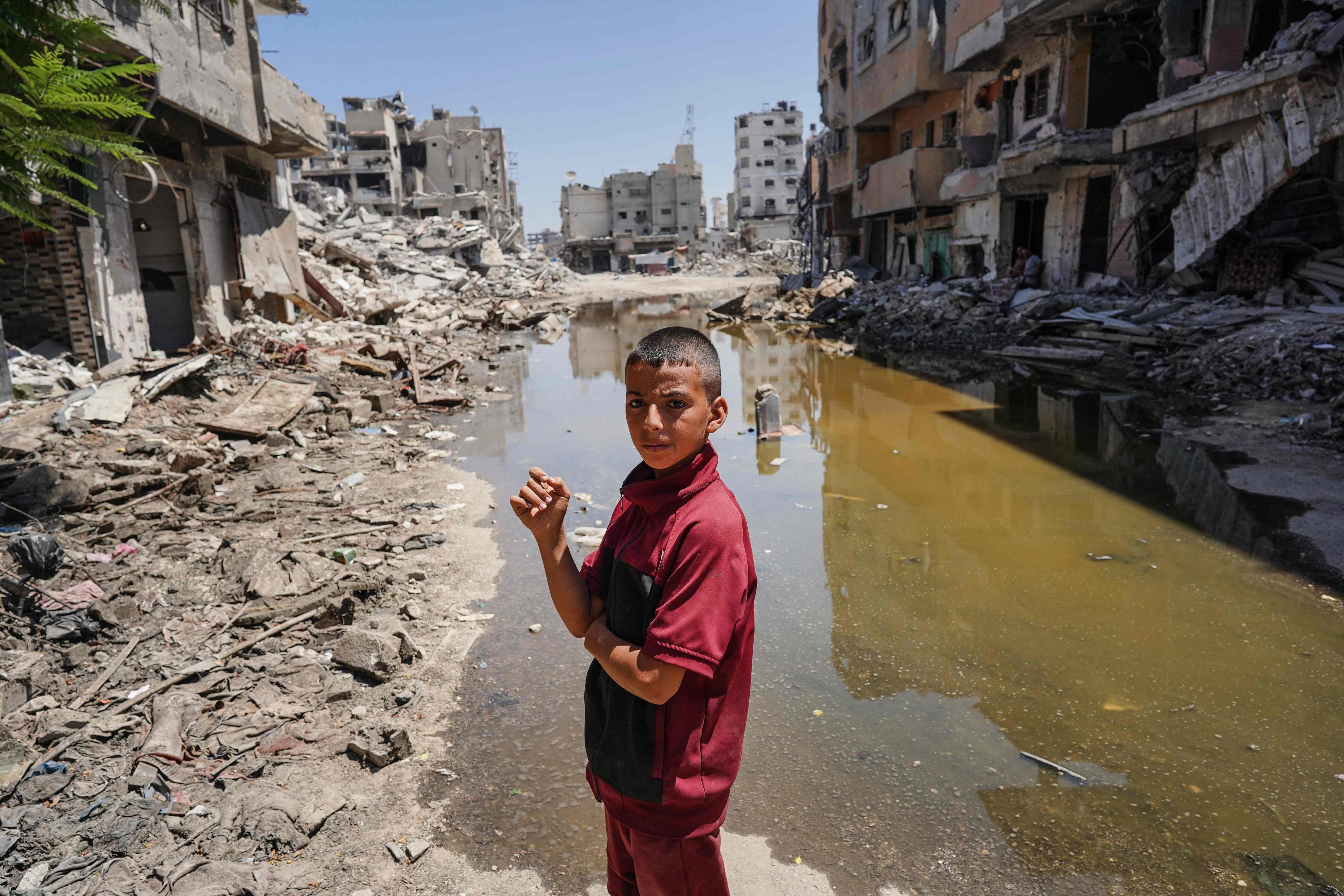 A Palestinian boy stands on the rubble of buildings in Khan Yunis. The UN’s top court on Friday said Israel’s decades-long occupation of Palestinian territory was “illegal” and needed to end as soon as possible. Photo: AFP