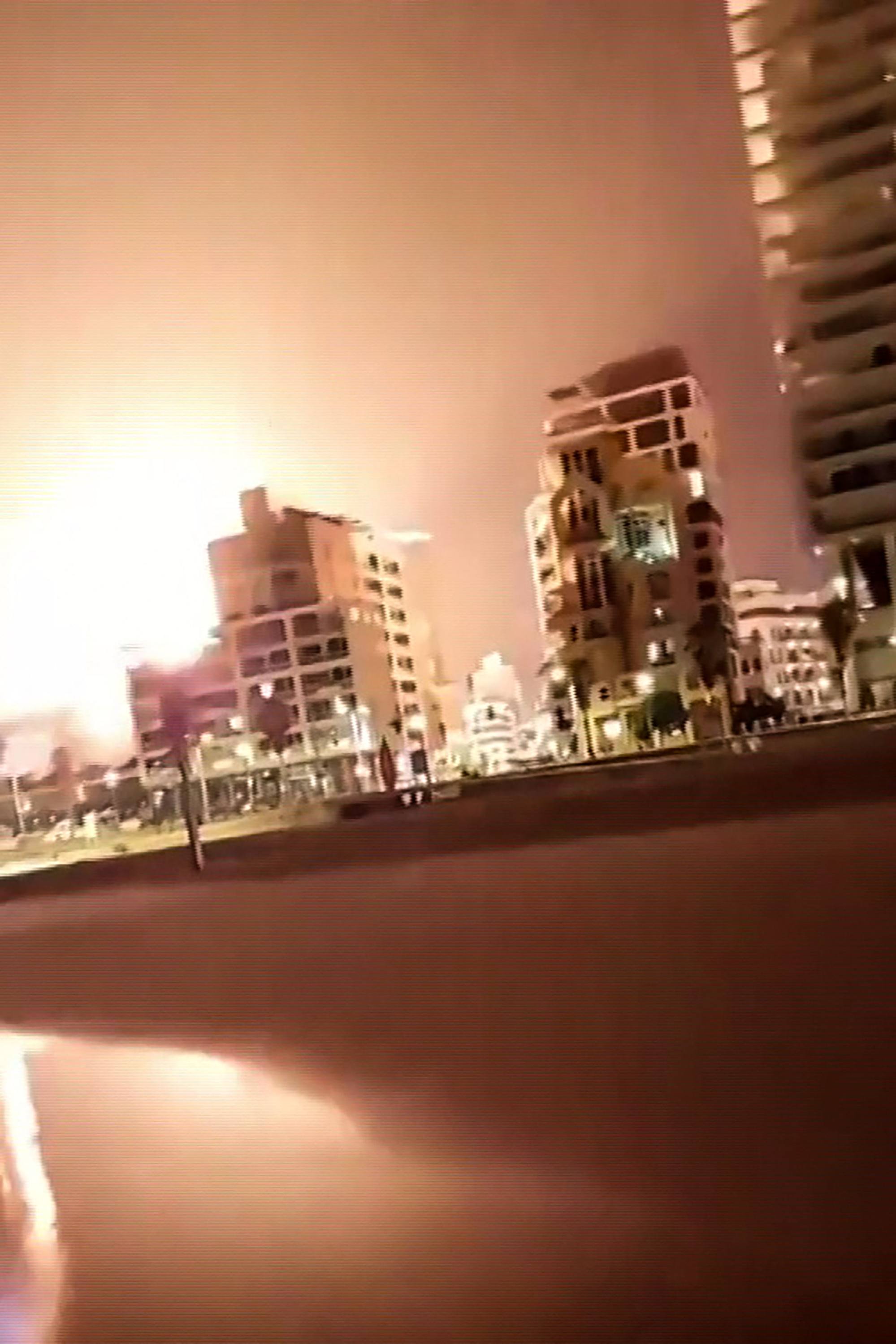 Video footage posted on Friday shows an explosion lighting up the sky in the Israeli coastal city of Tel Aviv. Photo: UGC via AFP
