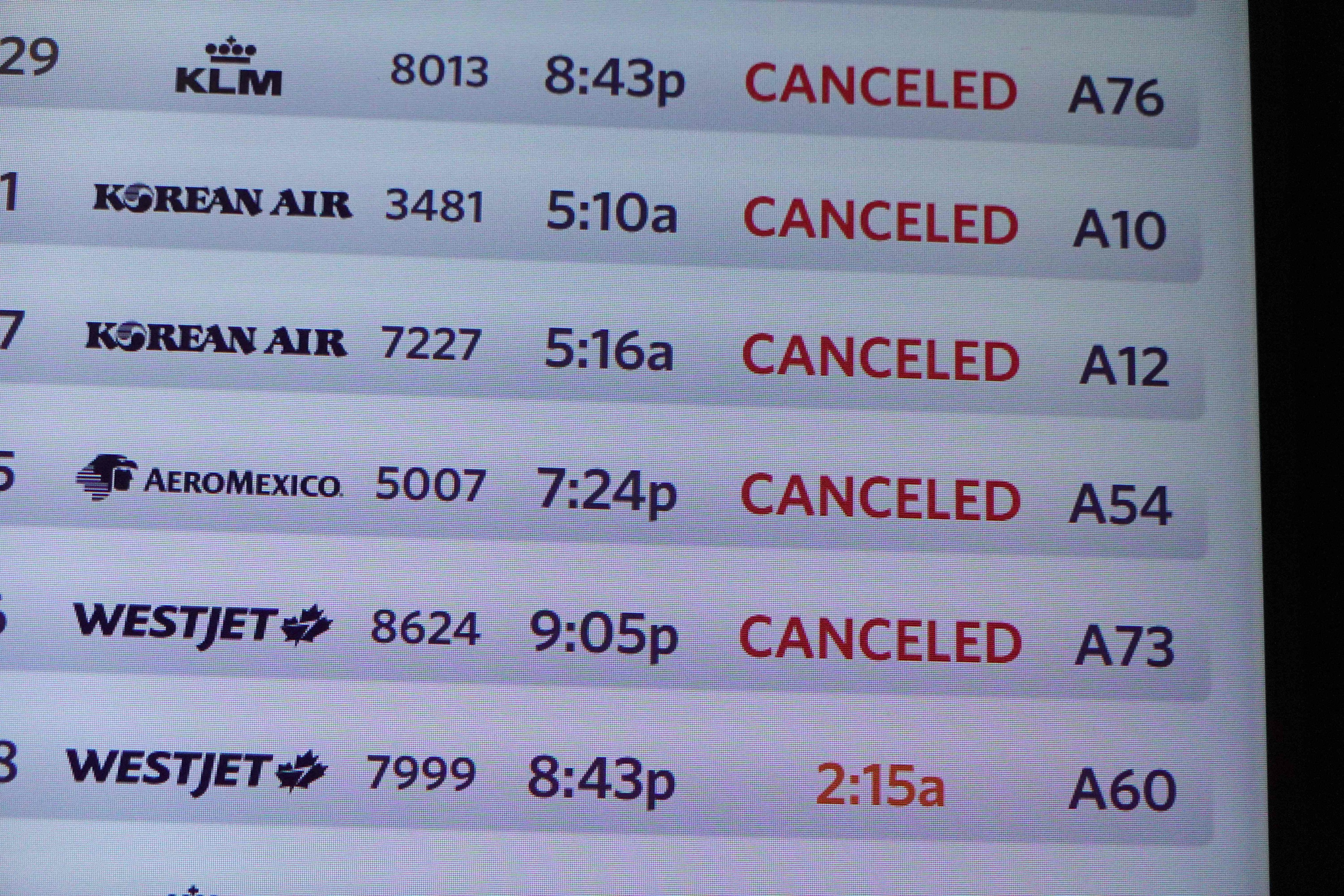 A departure board shows canceled flights at the Detroit Metropolitan Wayne County Airport on July 20, 2024. Photo: AFP