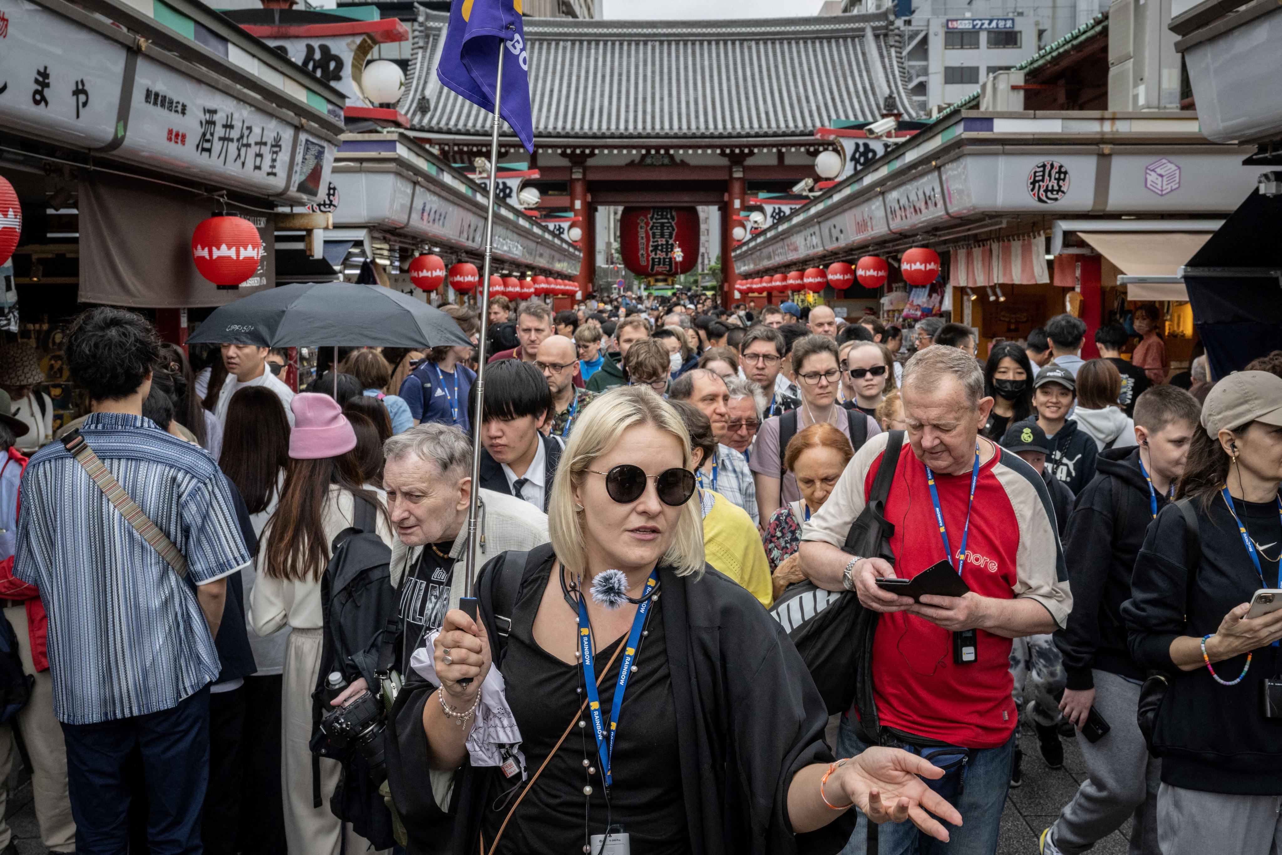 Tourists on Nakamise-dori, a shopping street near Sensoji Temple in Tokyo, Japan. Photo: AFP