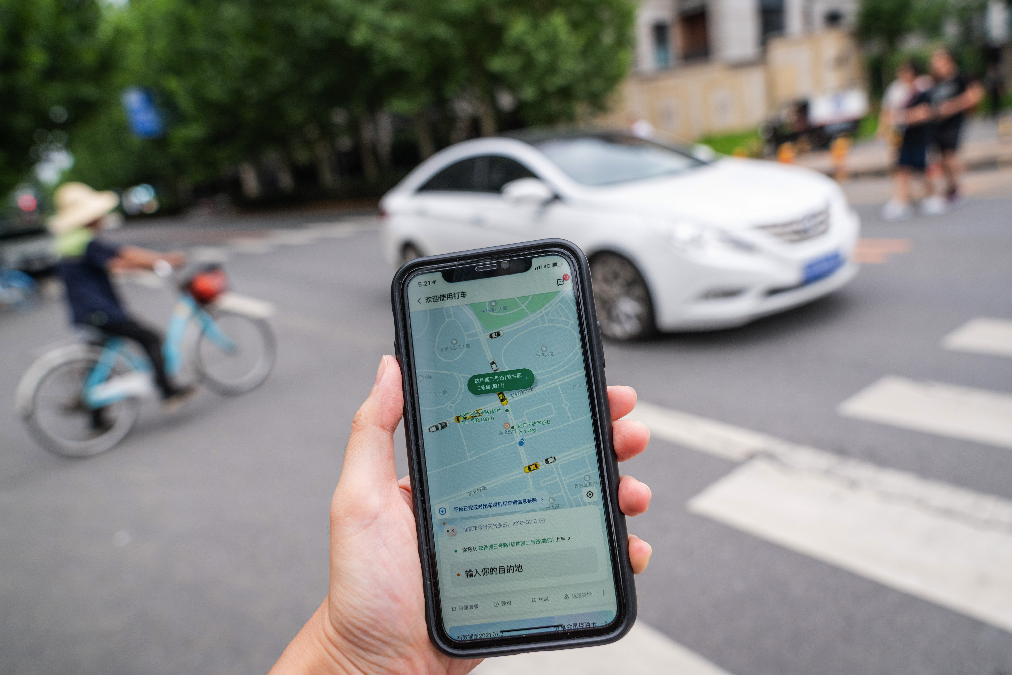 A ride-hailing app on a smartphone in Beijing. If platforms are allowed to charge arbitrary commission rates, drivers will become cheap labour for the platforms. Photo: Bloomberg 
