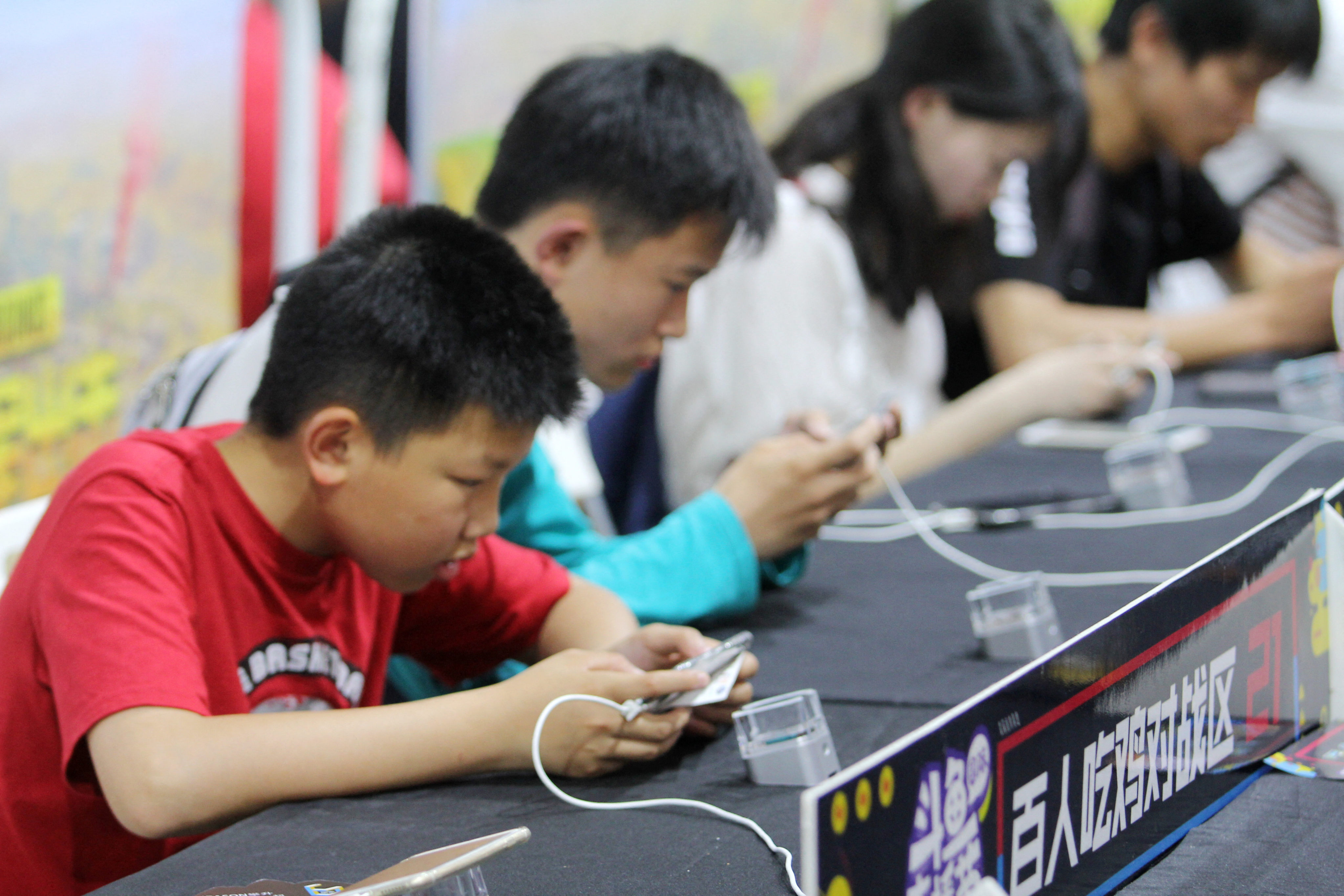 Chinese gamers compete while playing Tencent’s hit mobile title Honor of Kings in Wuhan on May 1, 2018. Photo: Imaginechina via AFP