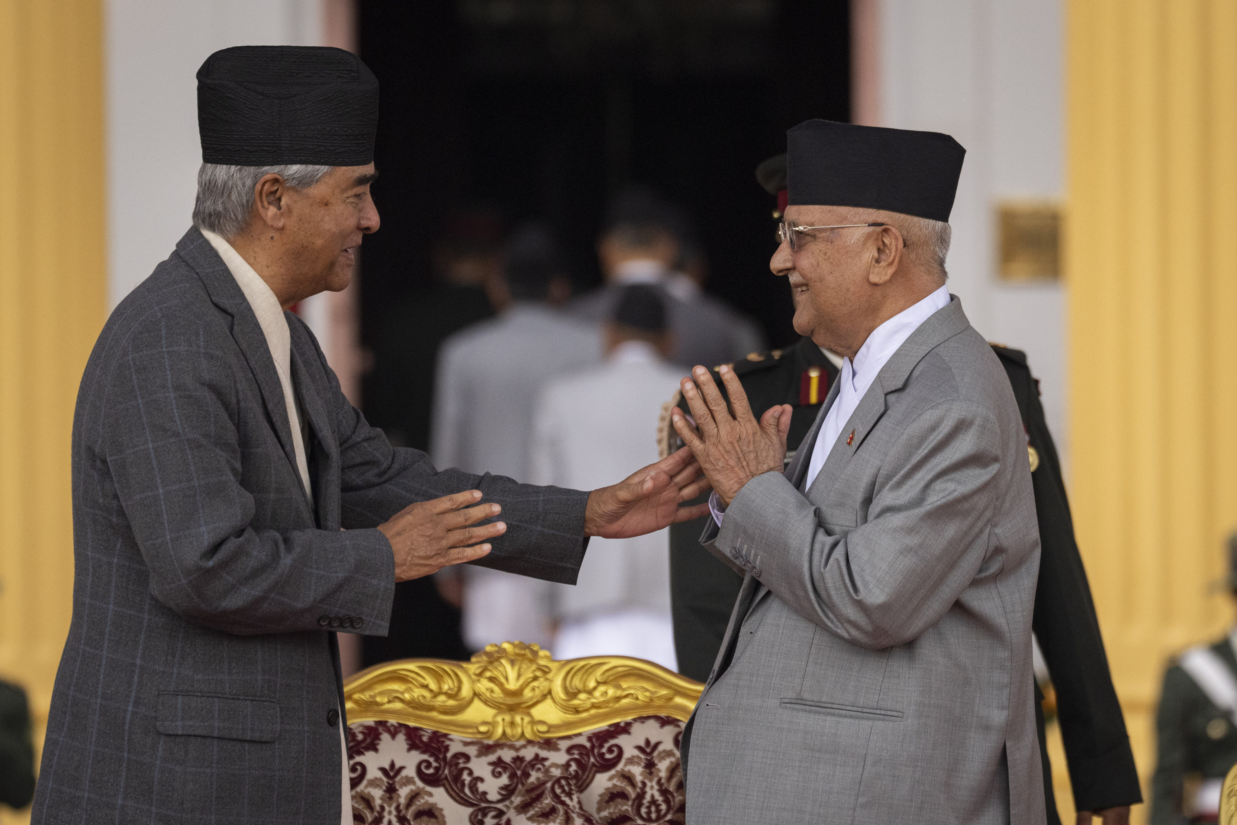 Nepal’s newly elected Prime Minister K.P. Sharma Oli (right) is congratulated by Nepali Congress Party Chairman Sher Bahadur Deuba in Kathmandu on July 15. Photo: AP