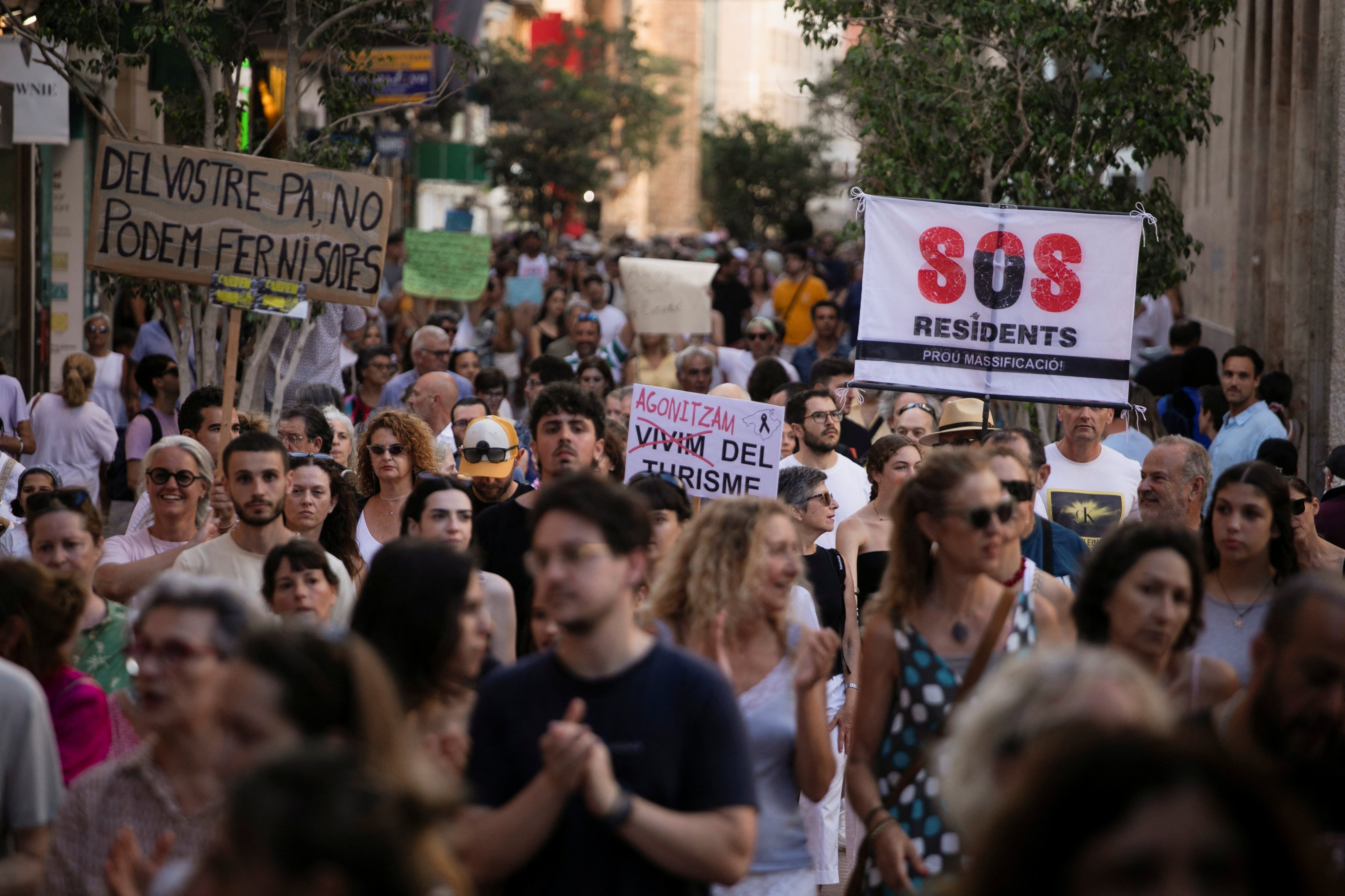 People take part in a protest against mass tourism in Palma de Mallorca, Spain on Sunday. Photo: Reuters
