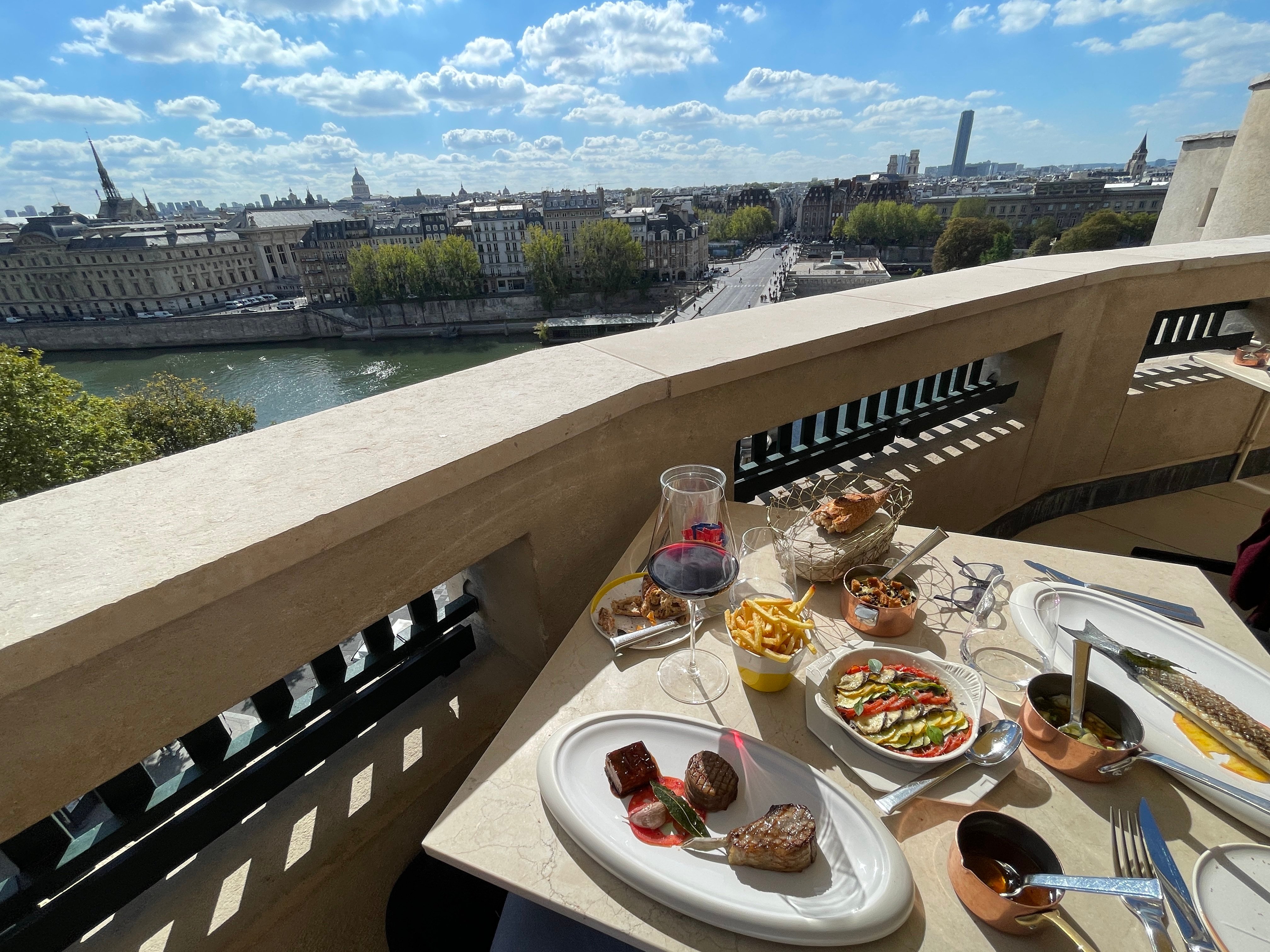 A lunch spread with classic Parisian views over La Conciergerie from the terrace of Le Tout-Paris. Photo: Chris Dwyer